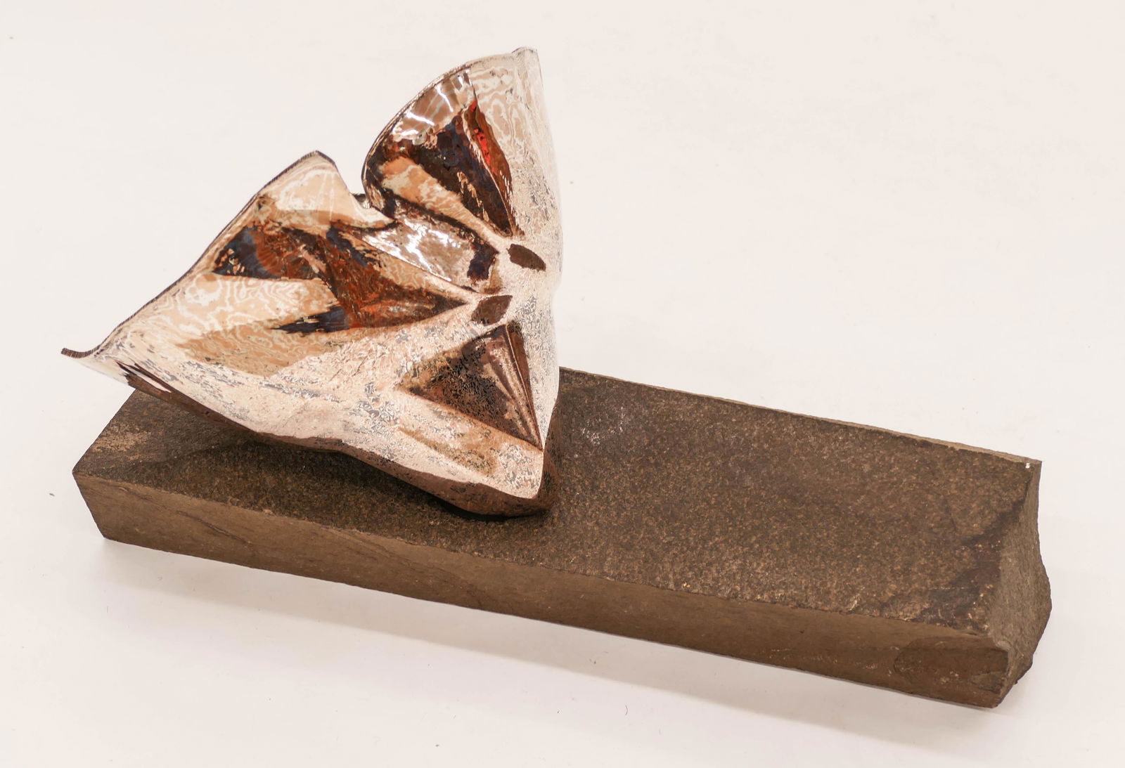 John Marshall (b.1936 Washington) Mokume-gane Mixed: John Marshall (b.1936 Washington) Mokume-gane Mixed Metals Vessel on Slab Sculpture 11.5''x18''. Handworked sculptural vessel 7''x10'' on carved stone slab platform. Unmarked. Bowl weighs 42.1 troy ou