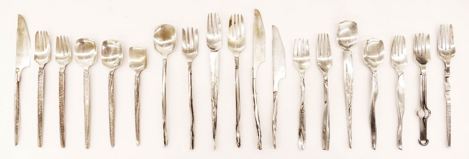 John Marshall (b.1936 Washington) 19pc Assorted Art: John Marshall (b.1936 Washington) 19pc Assorted Art Sterling Silver Flatware 8'' to 10''. Includes an assorted of four different patterns: Bloom, Latham, and Growth Cycle. Each piece is signed with in