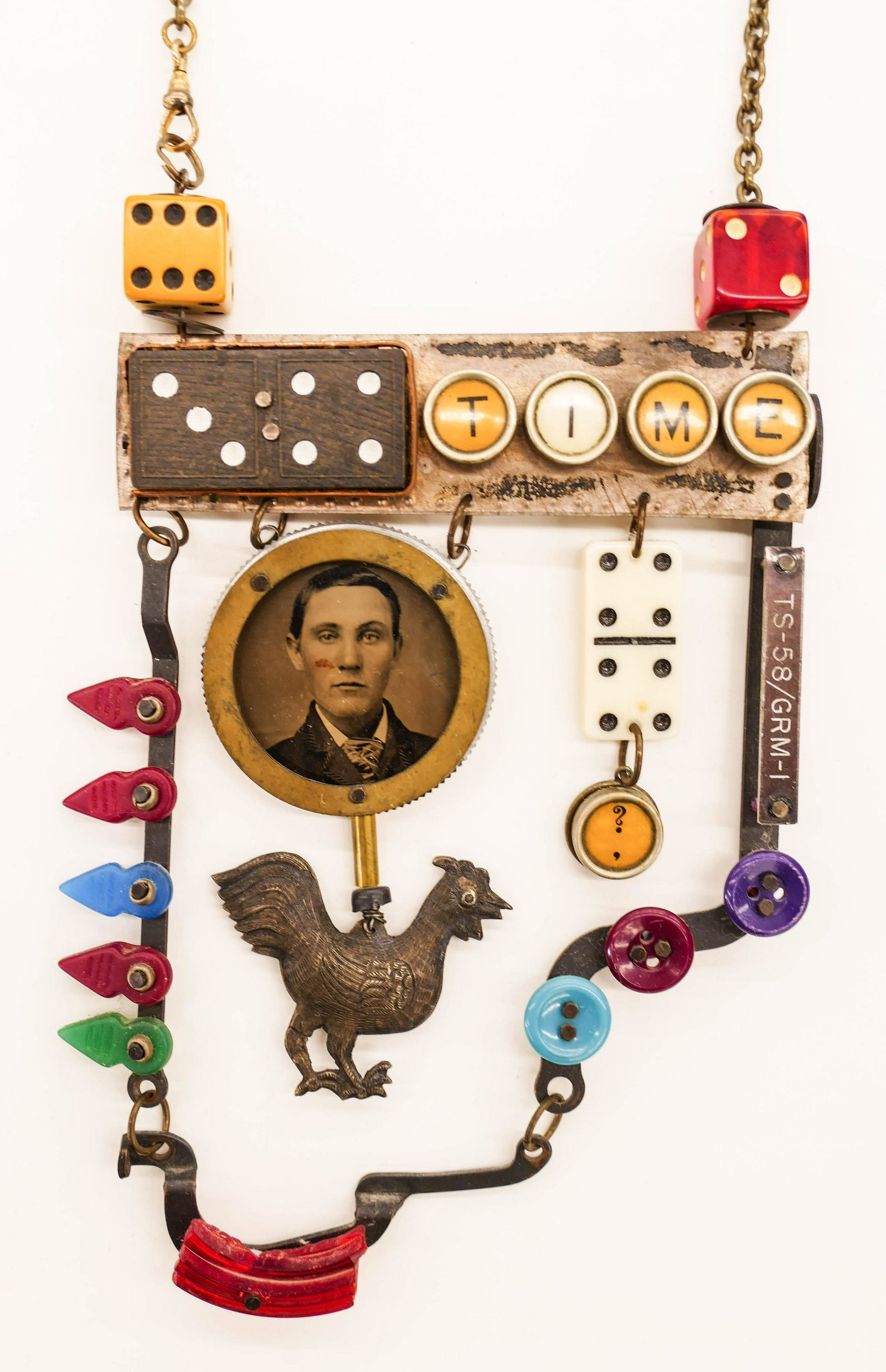 Chris Giffin (21st Cent. Oregon) ''Play Time'' 2003 Art: Chris Giffin (21st Cent. Oregon) ''Play Time'' 2003 Art Necklace Metal with Found Objects 15''x4''. A hand fabricated necklace with steel, brass, copper, found objects, dice, domino, and plastic butto