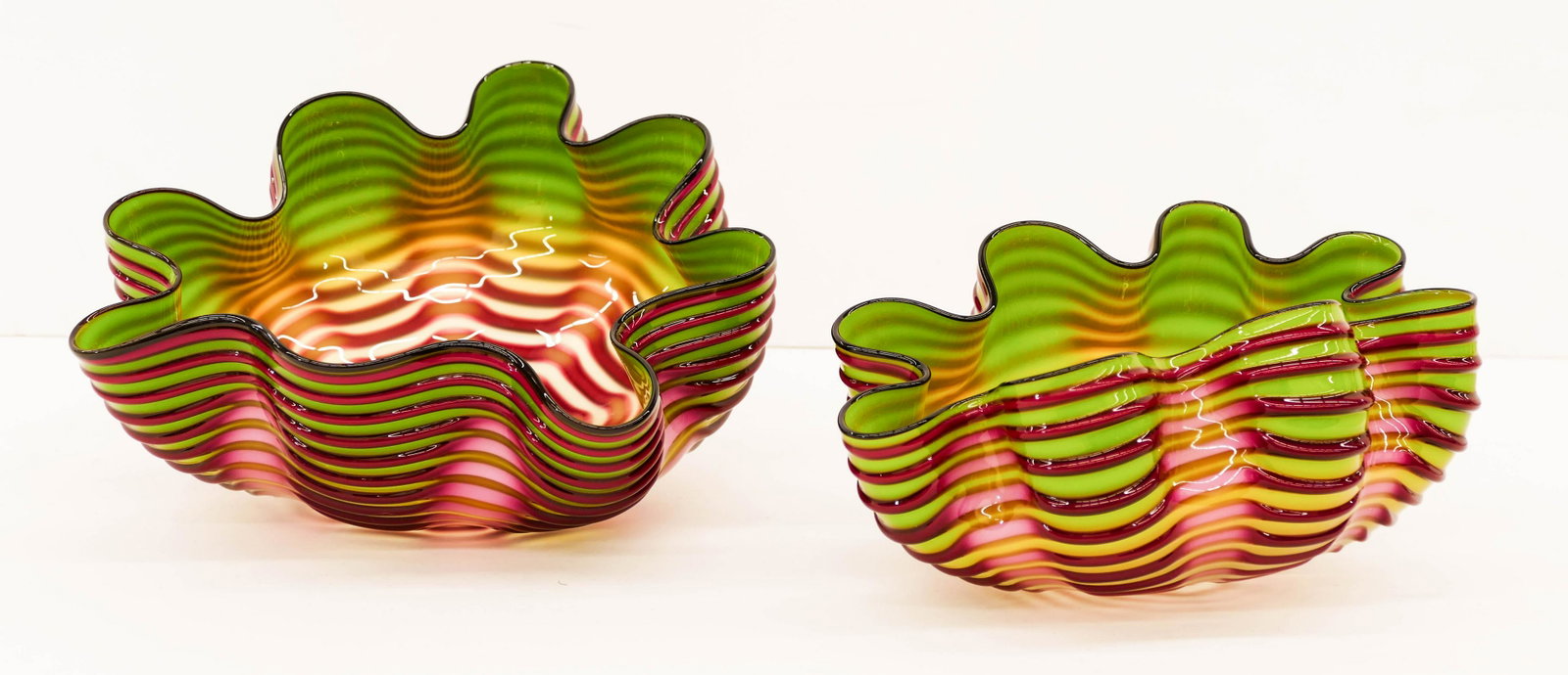 Dale Chihuly (b.1941 Washington) Royal Raspberry: Dale Chihuly (b.1941 Washington) Royal Raspberry Seaform Pair 2007 Blown Glass 6''x9''. A colorful multi-colored nesting set with black lip wraps. Smaller element measures 4''x8''. Portland Press Edit