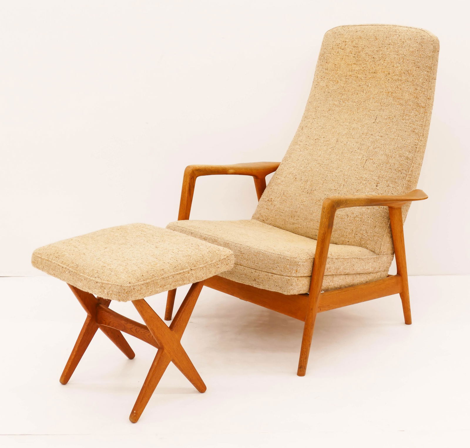 Folke Ohlsson for Dux Inc. Teak Lounge Chair and: Folke Ohlsson for Dux Inc. Teak Lounge Chair and Ottoman. Includes an upholstered reclining adjustable lounge chair 40''x29''x29'' and matching ''X'' frame ottoman 17''x16.5''x16.5''. Original tags on