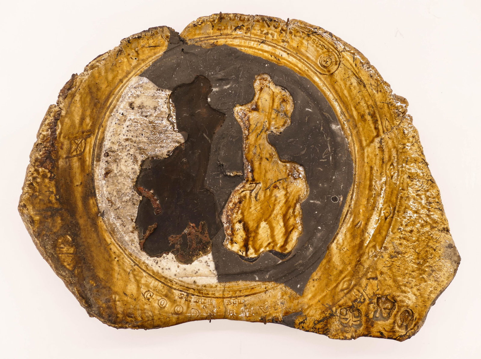 Paul Soldner (1921-2011 California) ''Goodyear Women'': Paul Soldner (1921-2011 California) ''Goodyear Women'' Raku Slab 11''x15''. An early funk pottery tray with impressed opposing women and goodyear tire border. Impressed marks near edge and signature o