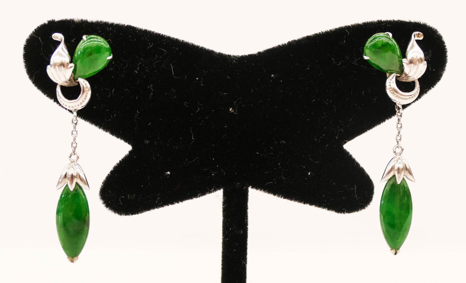 Pair of Lady's Jadeite Platinum Art Deco Earrings: Pair of Lady's Jadeite Platinum Art Deco Earrings 1.5''. A pair of dangle earrings with two apple green jade cabochons, tear drop 11x7mm and cat's eye 15x7mm. Unmarked with screw post backs. They weig