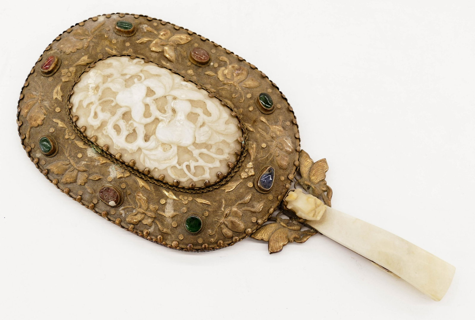 Old Chinese Jade Belt Hook Silver Hand Mirror: Old Chinese Jade Belt Hook Silver Hand Mirror 9.75''x4.5''. It has a white jade dragon belt hook 3.5'' handle and a white jade melon inset plaque 2.25''x3.75''. Repousse silver butterfly mount set wit