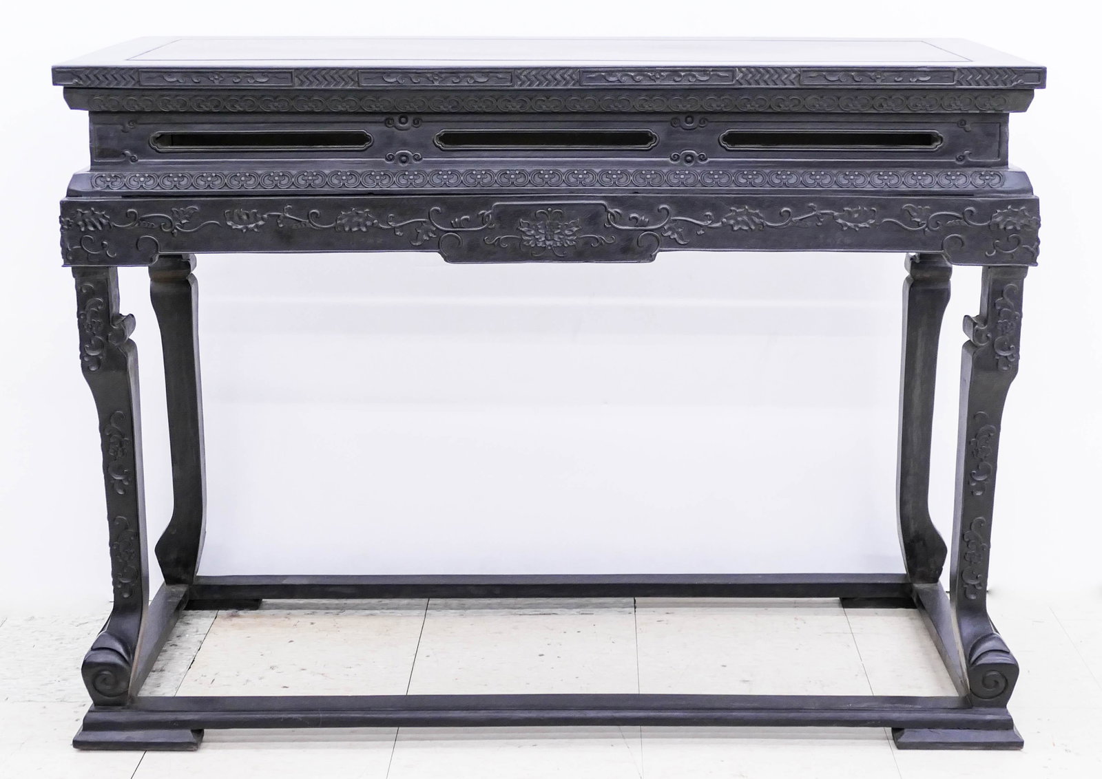 Fine Chinese Zitan Carved Altar Table 32.5''x46''x20''.: Fine Chinese Zitan Carved Altar Table 32.5''x46''x20''. Intricate relief carving with scrolling lotus flower motifs. A few small edge chips to wood. Overall excellent condition. 20th century.