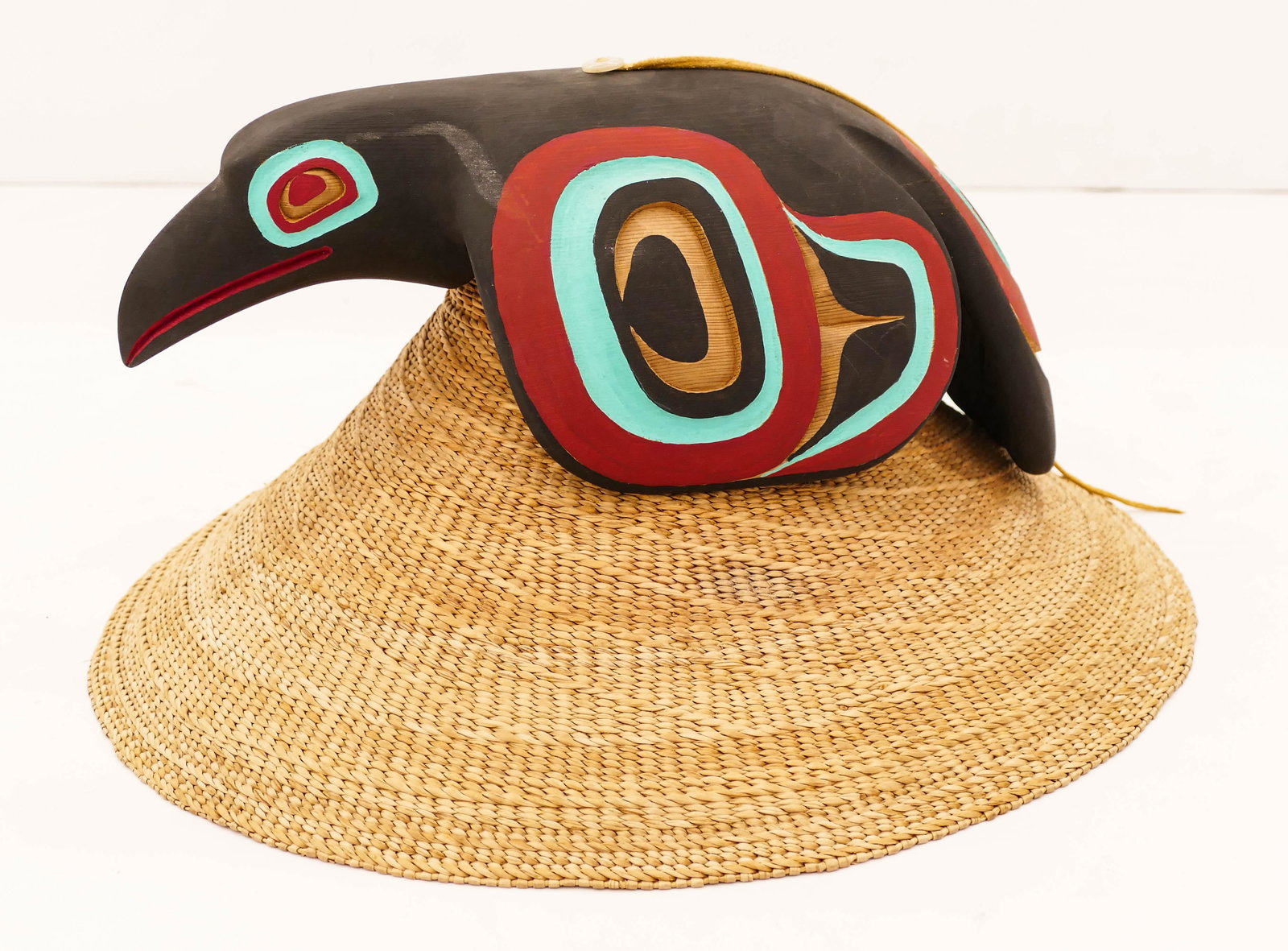 Clarence Peele Jr. (20/21st Cent. Haida) Raven Hat 2008: Clarence Peele Jr. (20/21st Cent. Haida) Raven Hat 2008 Painted and Woven Cedar 8''x16''. A carved and painted u-form cedar raven hat with woven basketry form. Signed under raven. A few minor surface 
