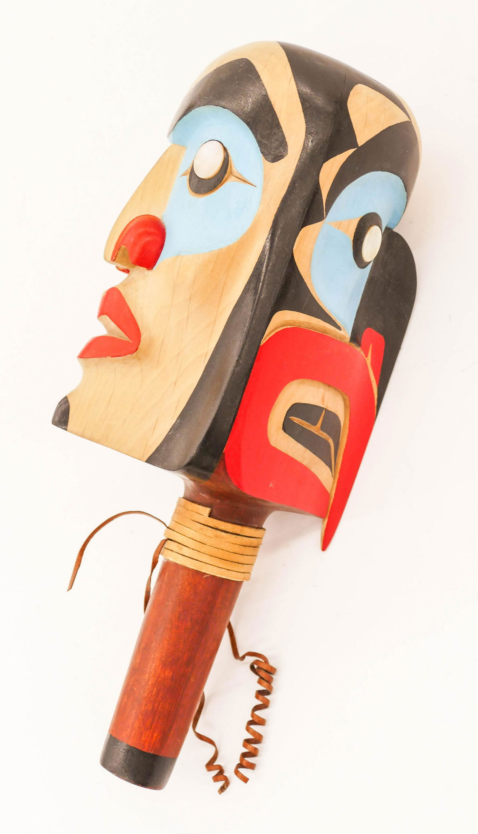 Chris Joseph (20/21st Cent. Salish) Human and Raven: Chris Joseph (20/21st Cent. Salish) Human and Raven Rattle Painted Cedar 11.5''x5''. A split two-faced carved and painted u-form rattle with abalone shell eyes. Signed on bottom of handle. Excellent c