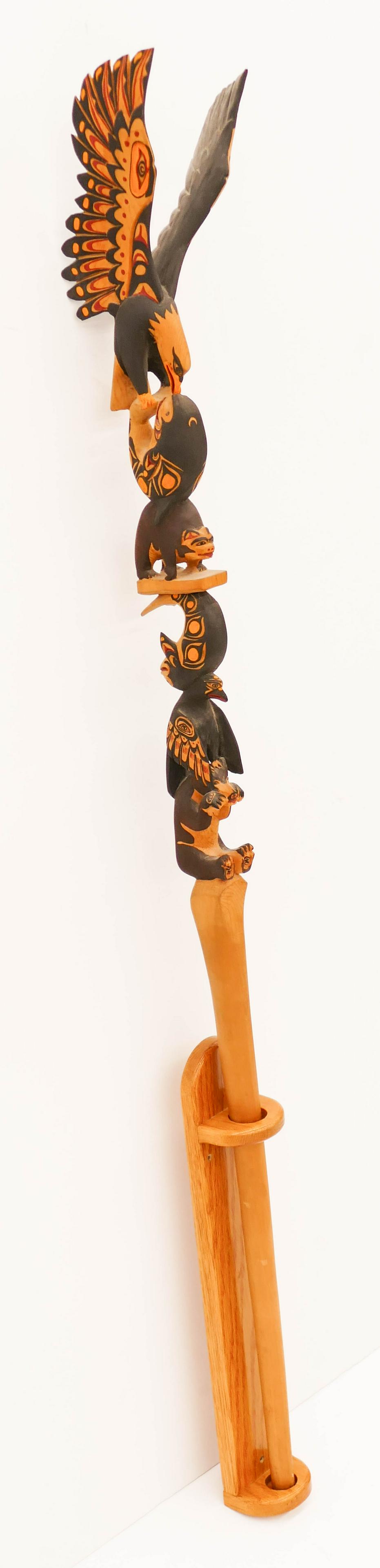 Simon Charlie (1919-2005 Cowichan) Eagle Talking Stick: Simon Charlie (1919-2005 Cowichan) Eagle Talking Stick 1985 Painted Cedar 57.5''x7''. Impressive polychrome painted and carved u-form talking or dance stick with eagle, killer whale, and bear motifs. 