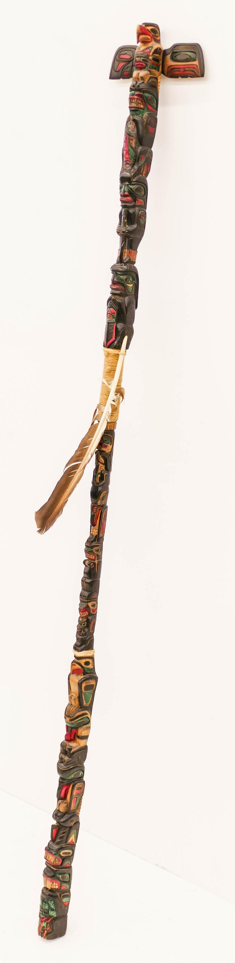 Andy Bruce (b.1970 Kwakiutl) Kwakiutl Talking Stick: Andy Bruce (b.1970 Kwakiutl) Kwakiutl Talking Stick 1987 Painted Cedar 65''x8''. Polychrome painted and carved u-form staff with eagle, bear, warrior, chief, thunderbird, raven, killer whale, etc. mot