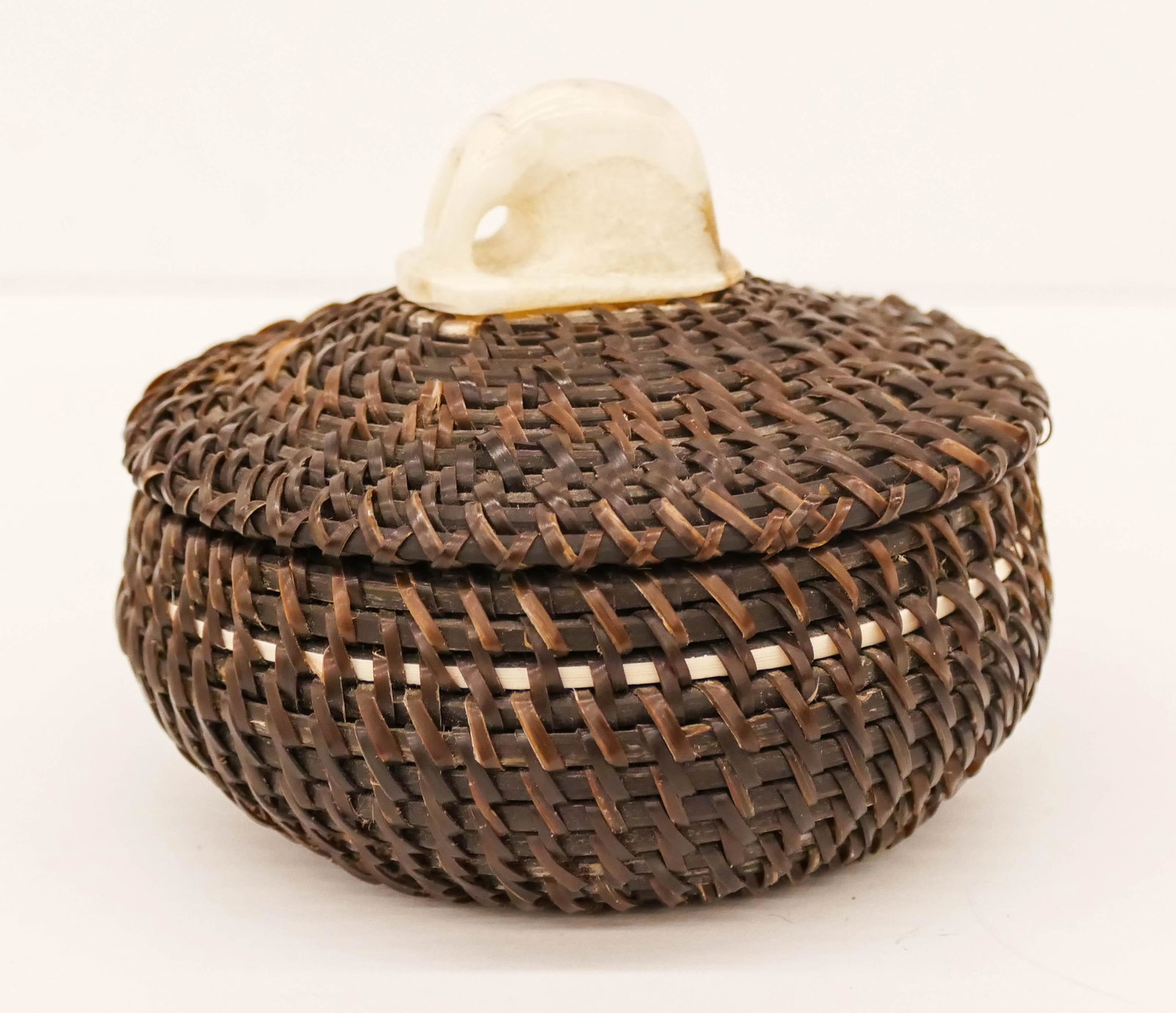 Joe Sikvayugak (1898-1983 Inuit) Baleen Covered Basket: Joe Sikvayugak (1898-1983 Inuit) Baleen Covered Basket 3''x4''. A covered eskimo trinket basket. Signed and dated 1970 on bottom. Excellent condition.