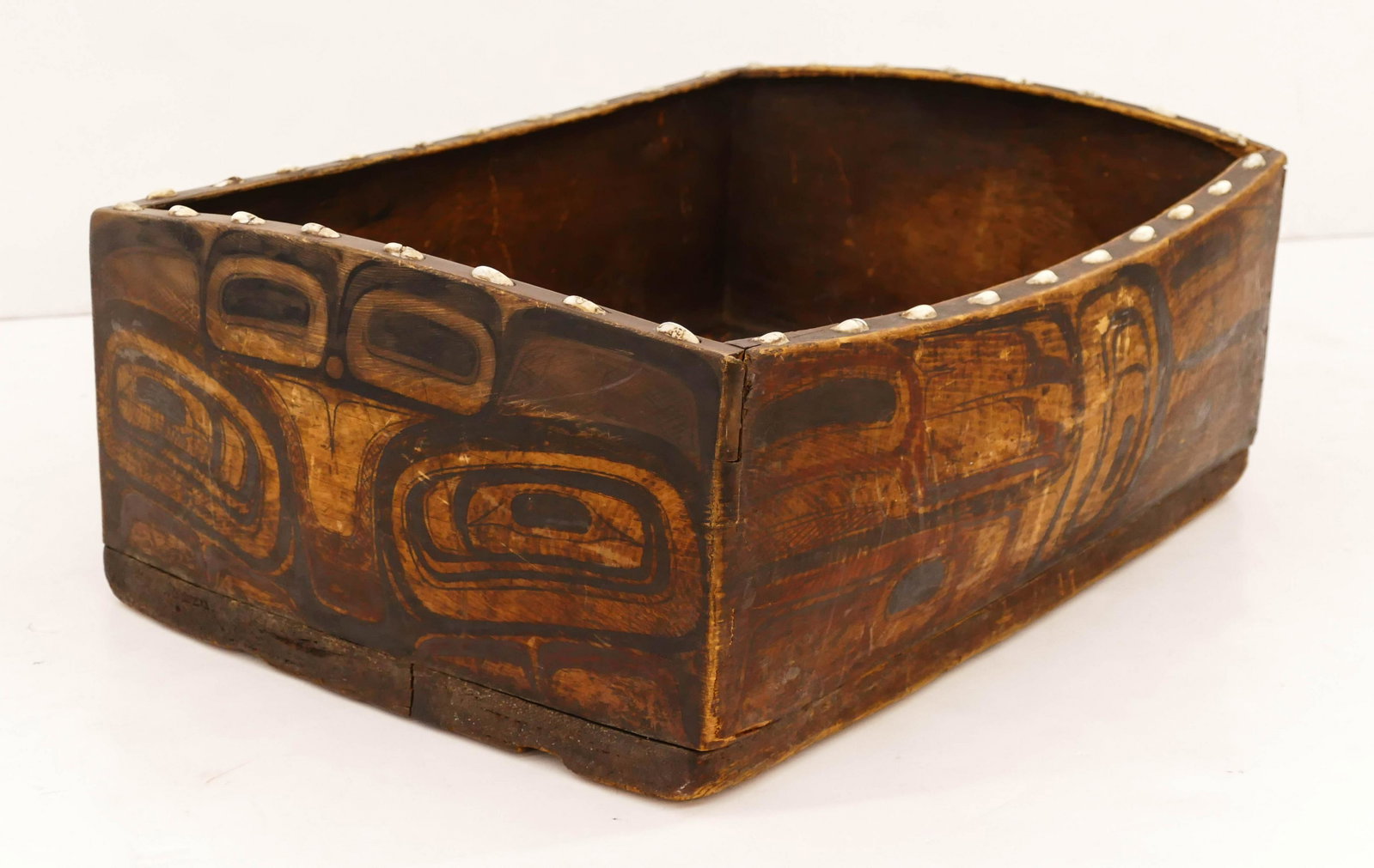Antique Bella Bella (Heiltsuk) Decorated Bent Corner: Antique Bella Bella (Heiltsuk) Decorated Bent Corner Bowl 7.5''x21''x16''. Museum quality polychrome u-form painted bentwood cedar bowl with operculum shell inlays on top edge. Purchased February 15th