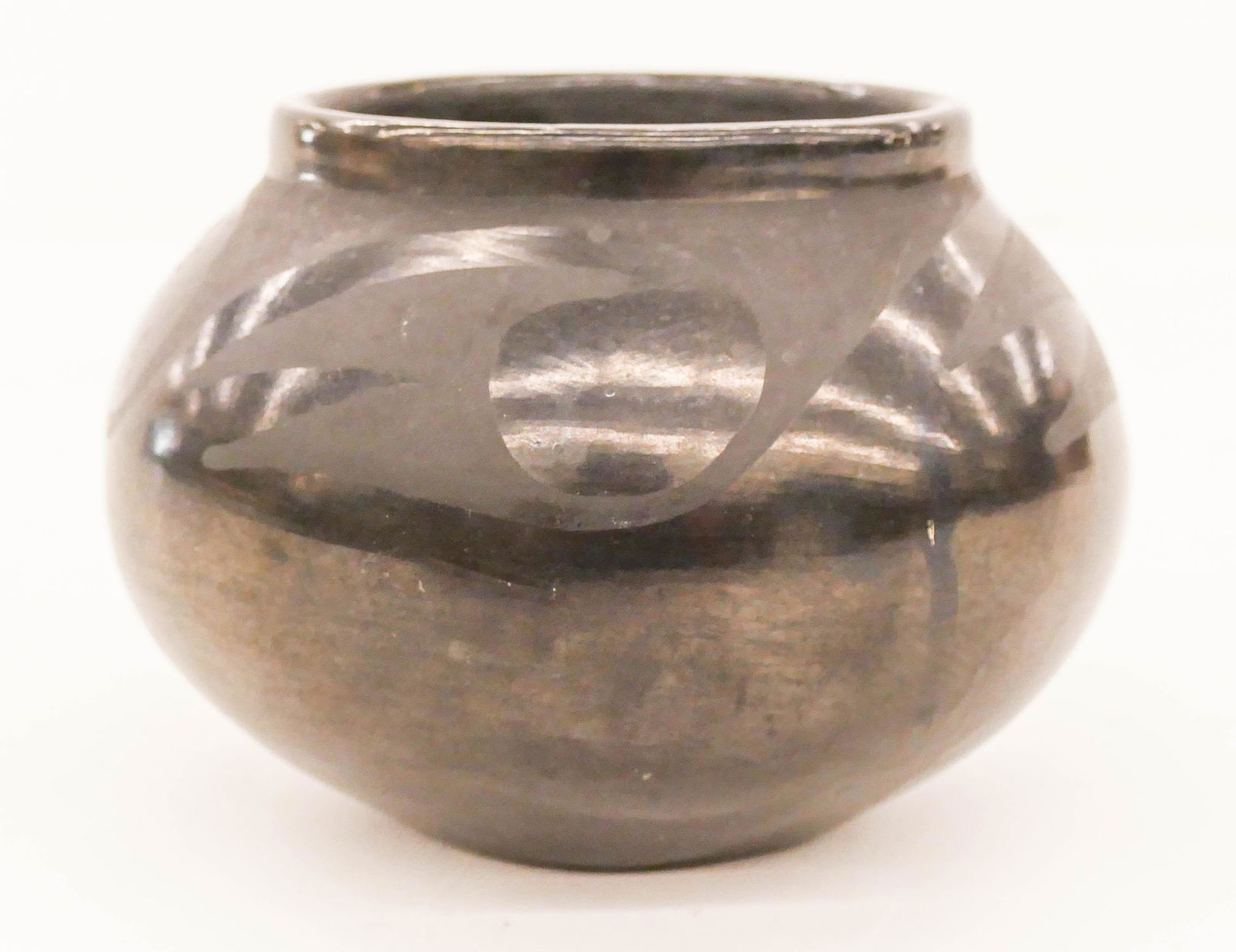 Marie Martinez (1887-1980 San Ildefonso) Decorated: Marie Martinez (1887-1980 San Ildefonso) Decorated Blackware Jar 3.5''x5''. A small pottery jar with repeating motif. Signed ''Marie'' on bottom. Scattered light surface wear.