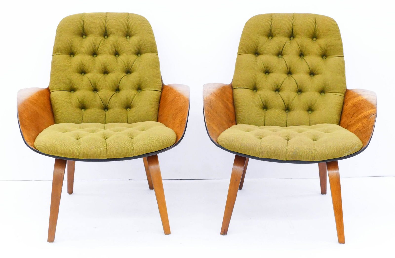Pair of George Mulhauser for Plycraft Mr. Lounge Chairs: Pair of George Mulhauser for Plycraft Mr. Lounge Chairs 32''x29''x26''. An early pair of laminated bent walnut chairs with original green tufted cushions. Unmarked. Heavy scattered surface wear. One h