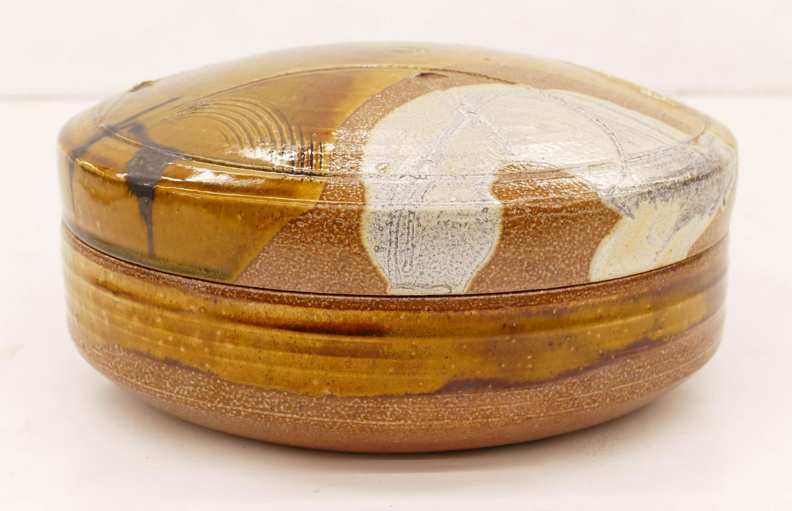 Kurt Weiser (b.1950 American) Covered Box Glazed: Kurt Weiser (b.1950 American) Covered Box Glazed Stoneware 5''x11''. An early salt glazed box with sgraffito decoration. Signed on bottom. Some minor kiln chipping to bottom edge, original to its manu
