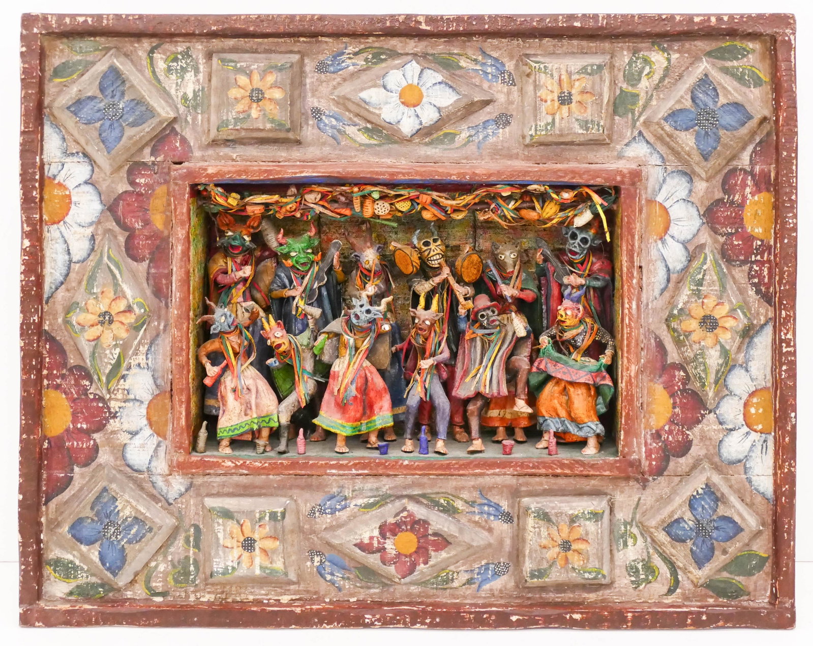 Nicario Jimenez (b.1957 Peruvian) Retablo Painted Wood: Nicario Jimenez (b.1957 Peruvian) Retablo Painted Wood and Paper Mache 16''x20''x3''. A folk art retablo with applied paper mache devil figures. Signed on verso. One figure is loose with a few small c