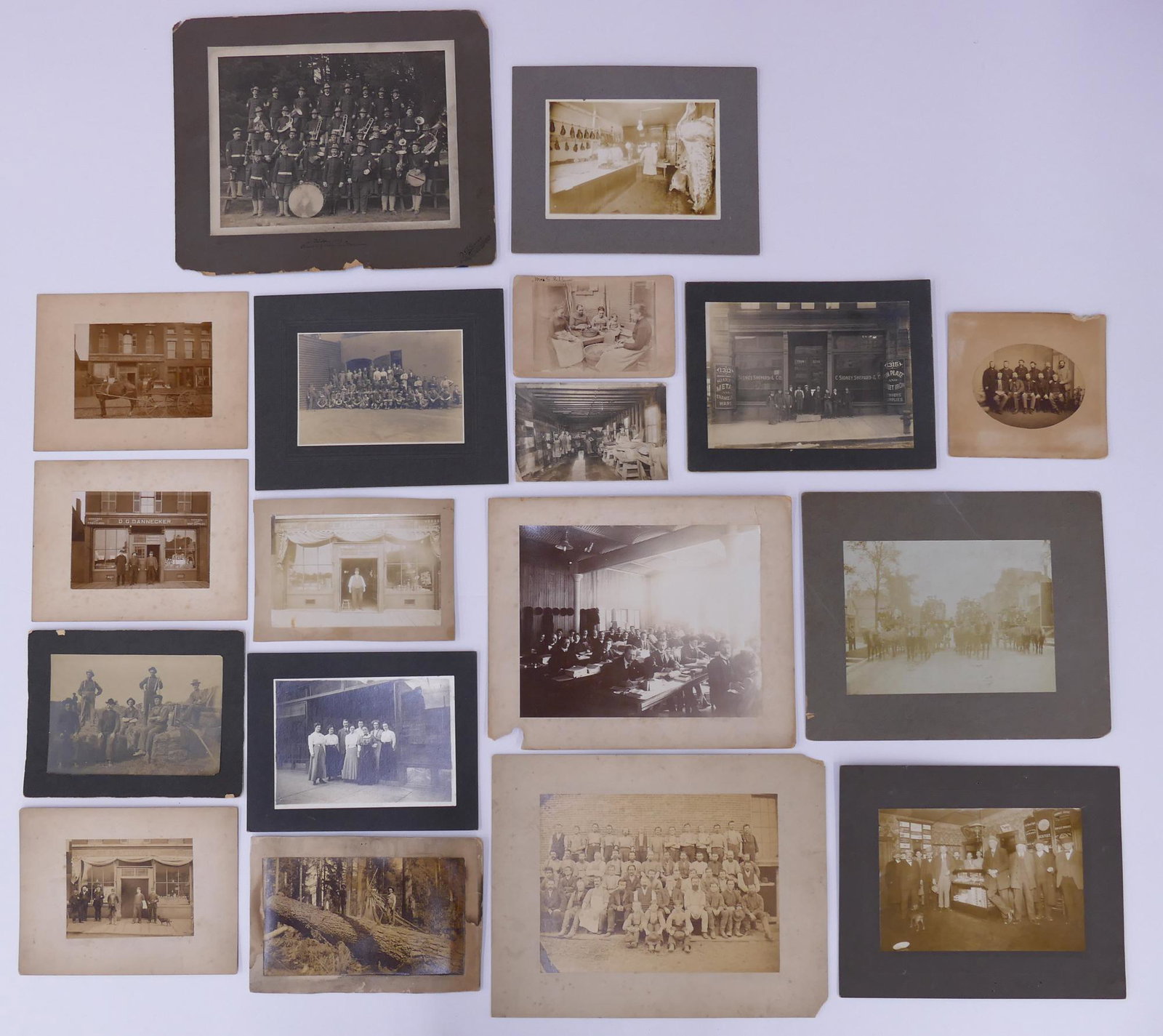 18pc Card Mounted Photographs of Workers: 18pc Collection of Card Mounted Photographs of Workers. Lot includes images of loggers (I.N. Wilson, Oregon), the D.G. Dannecker General Store in Buffalo, NY, Famers, Dress Shop Employees, Butchers, C