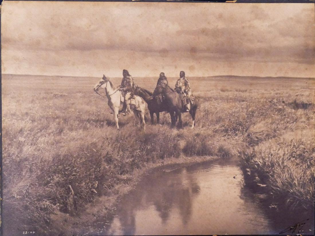 Edward Curtis 'The Three Chiefs' Platinum Print: Edward Curtis (1868-1952 Washington) 'The Three Chiefs' 1905 Platinum Print. Image measures 12x16''. Print is laid down to board, scattered scratching especially around lower right signature. Foxing t