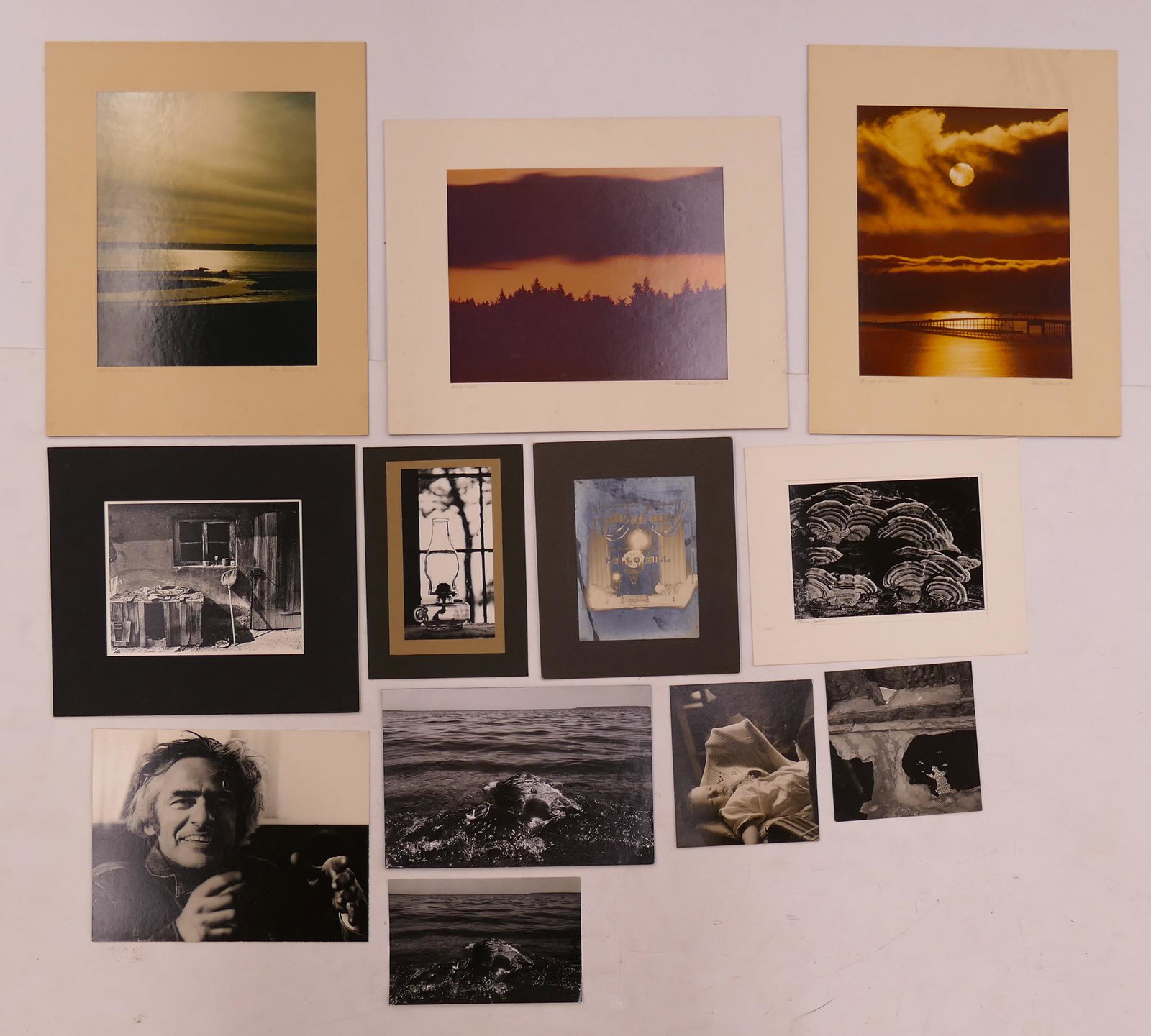 12pc Card Mounted Photographs: 12pc Card Mounted Photographs from the Collection of Tom Haseltine. Includes 3pc landscape images (14x11'' each) by Tom Haseltine, a pirtrait of Oregon artist Lee Kelly by Tom Harding, 2pc 'Dead Deer'