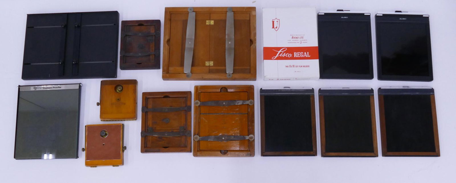 14pc Camera and Film Developing Equipment: 14pc Camera and Film Developing Equipment. Includes 4pc Wood Printing Frames (11x14, 10x8, 8.5x6.5, and 7x5), 5pc Cut Film Holders (all 8x10 with 2 Lisco Rhino-Lite and 3 wood frame), 2pc Graflex Wood