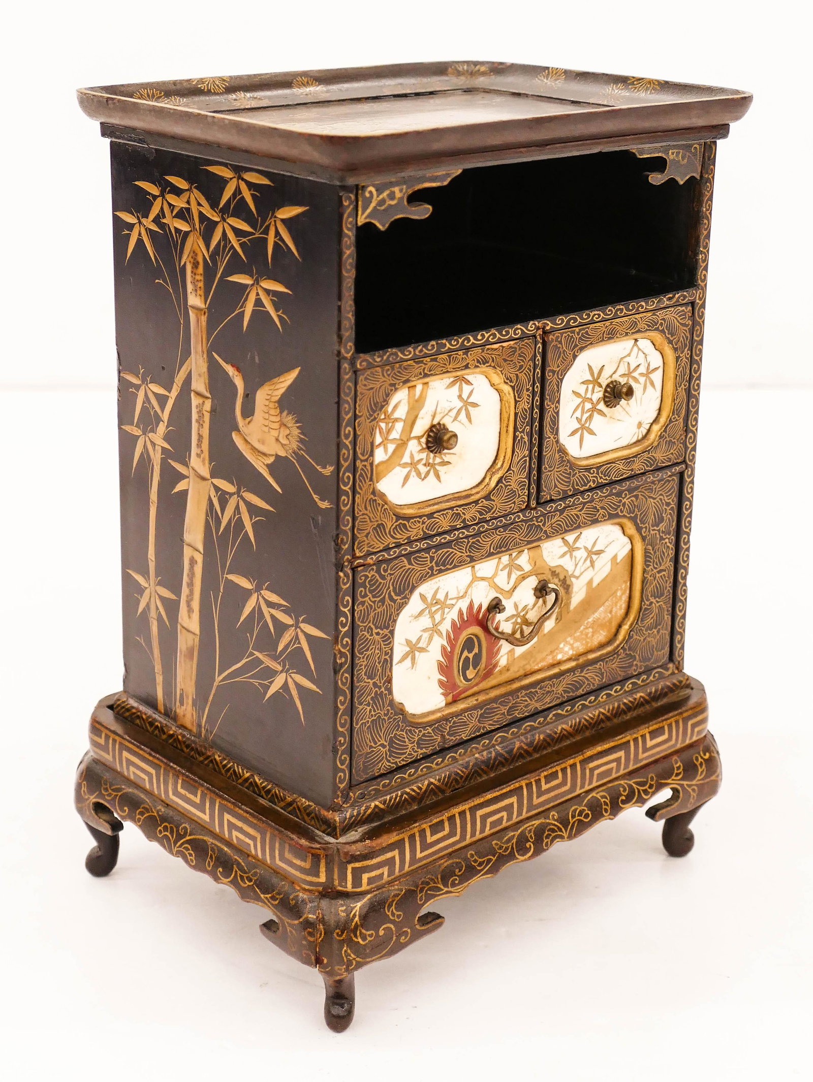 Japanese Meiji Lacquered Table Cabinet 10''x7''x5.5'': Japanese Meiji Lacquered Table Cabinet 10''x7''x5.5''. A maki-e gold lacquered collector's cabinet with three decorated bone front drawers. Decorated on all sides with hawk and pine tree motif. Some o