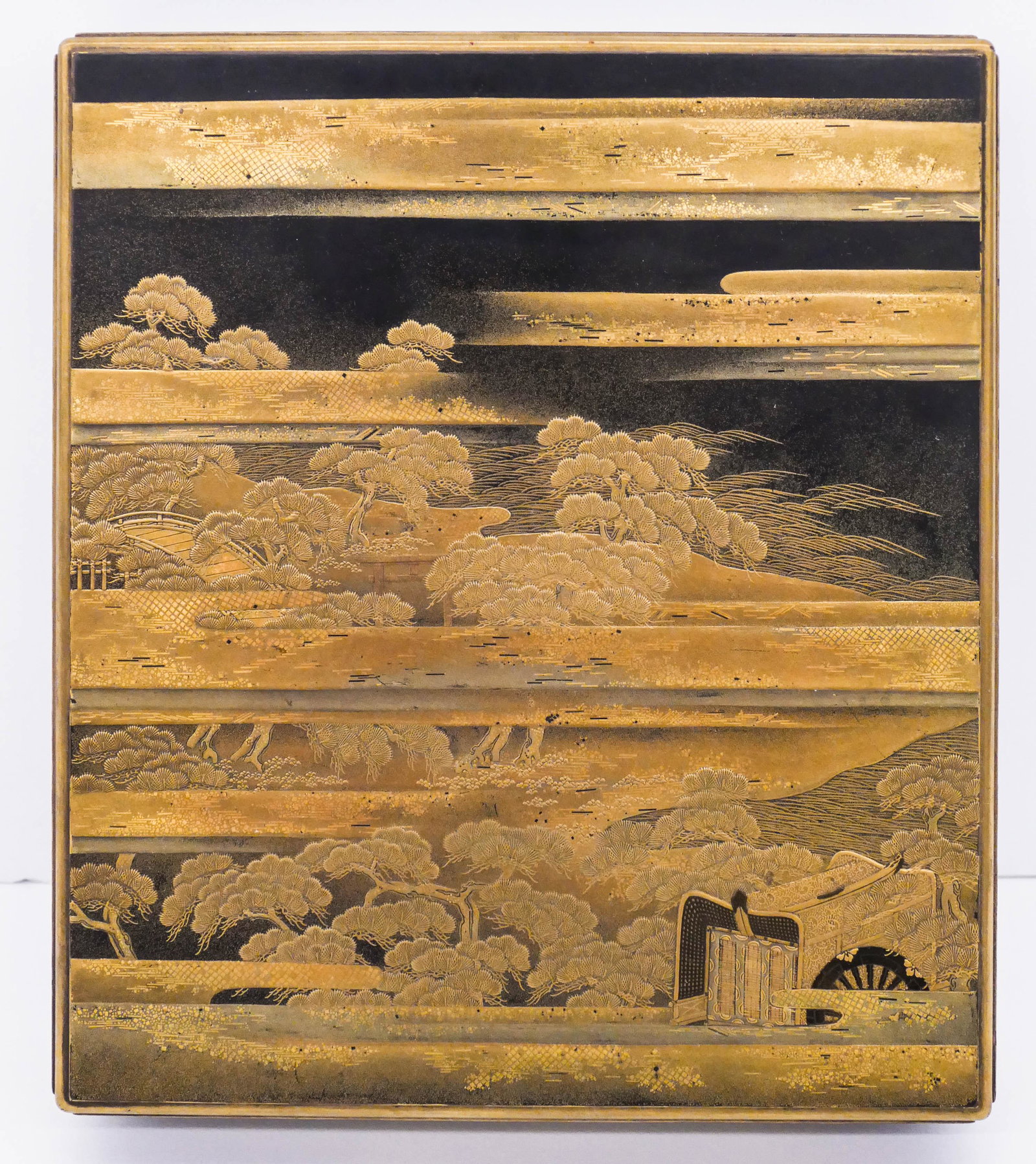 Fine Japanese Meiji Lacquered Suzuribako Writing Box: Fine Japanese Meiji Lacquered Suzuribako Writing Box 9''x8''x2''. An intricate maki-e decorated box with pine tree landscape with bridge landscape. Interior is decorated with blossoming flower motifs.