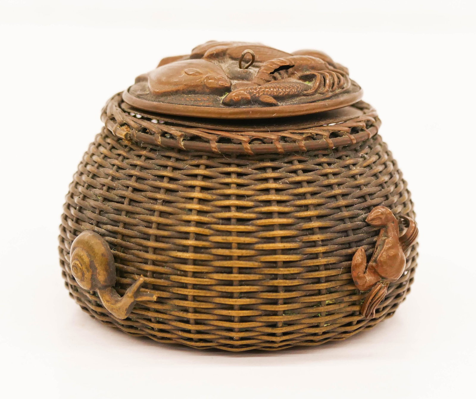 Japanese Meiji Fish Basket Metal Inkwell: Japanese Meiji Fish Basket Metal Inkwell 1.75''x2.75''. A figural basket inkwell with various fish and applied seafood. Excellent condition. Estate of Margaret Flagg, Maryland.
