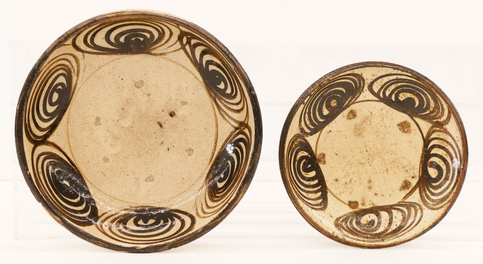 2pc Japanese Edo Seto Ware Horse Eye Bowl and Plate: 2pc Japanese Edo Seto Ware Horse Eye Bowl and Plate 8'' to 10.5''. Includes a large shallow bowl (minor edge chips, small hairline) and a smaller plate (hairline crack). 18th to early 19th century. Co