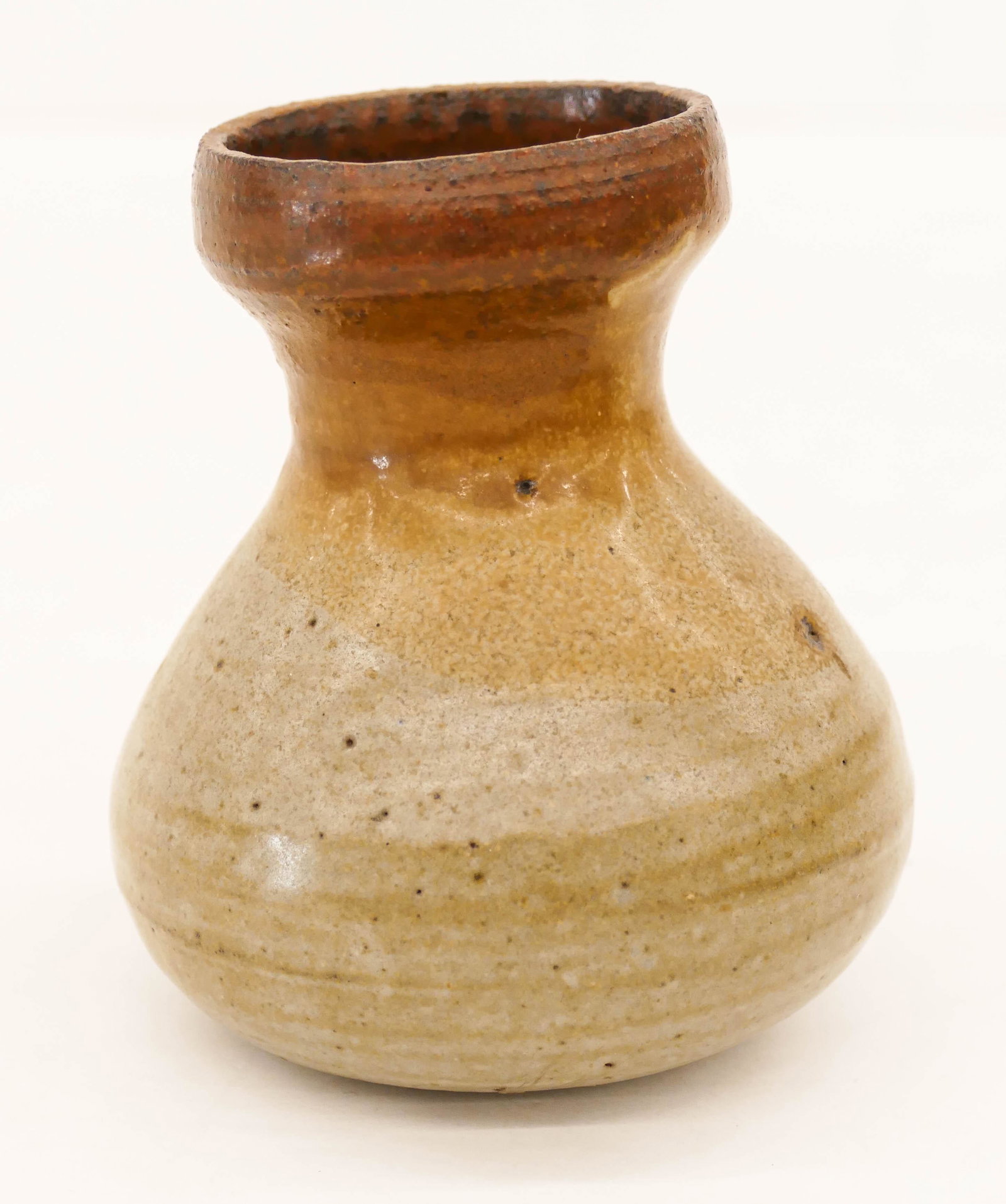 Korean Goryeo Celadon Ceramic Bottle 4''x3.5'': Korean Goryeo Celadon Ceramic Bottle 4''x3.5''. Unusual bottle with brown glaze rim. Scattered kiln frit on bottom. Excellent condition. 12th to 13th century. Collection of W. Gordon Menzies, Seattle.