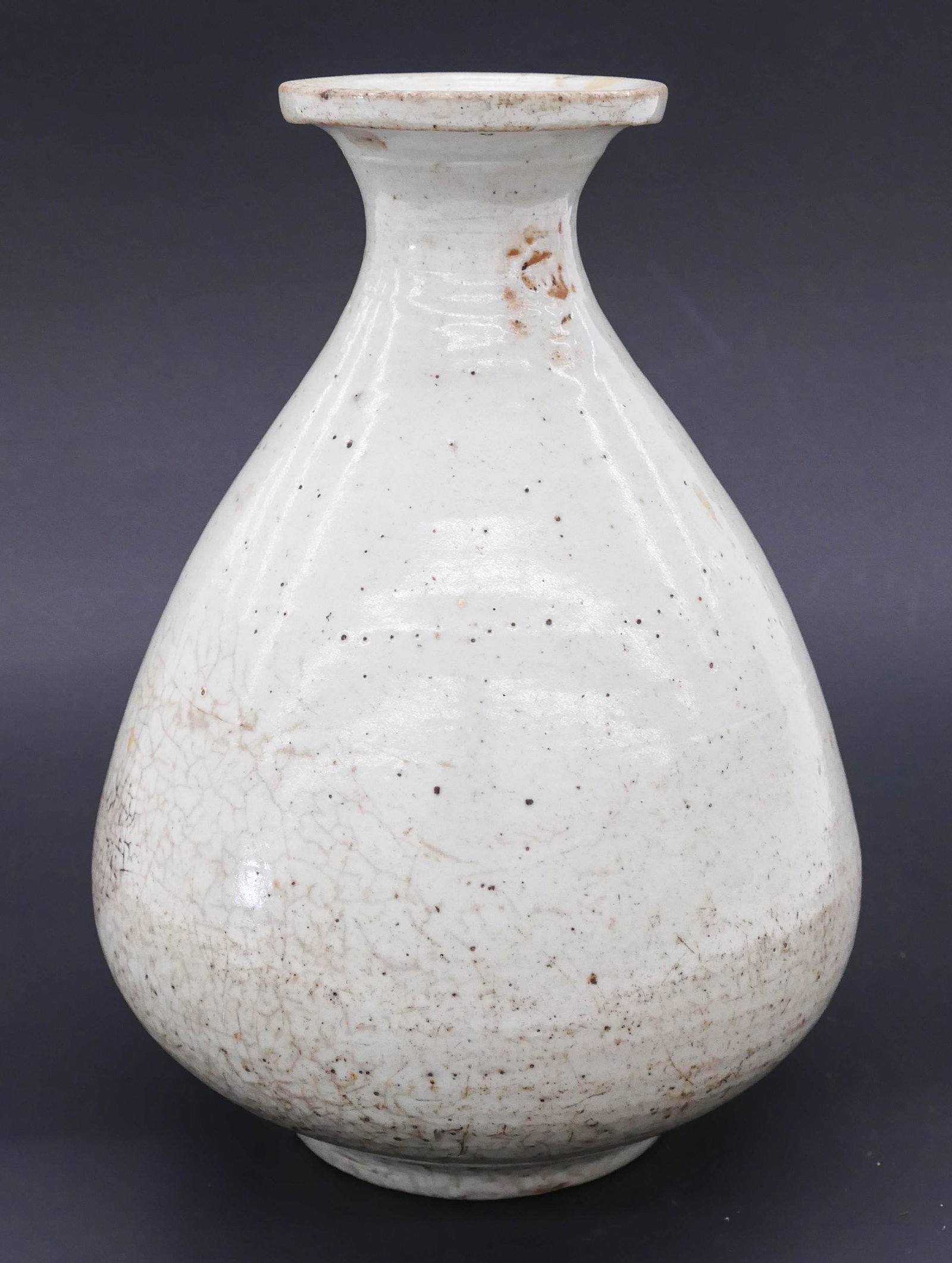 Korean Joseon Pear Shaped White Bottle 7''x5'': Korean Joseon Pear Shaped White Bottle 7''x5''. A simple white porcelain bottle form. Slight impact mark to top rim and kiln chip to foot. 17th century. Collection of W. Gordon Menzies, Seattle.