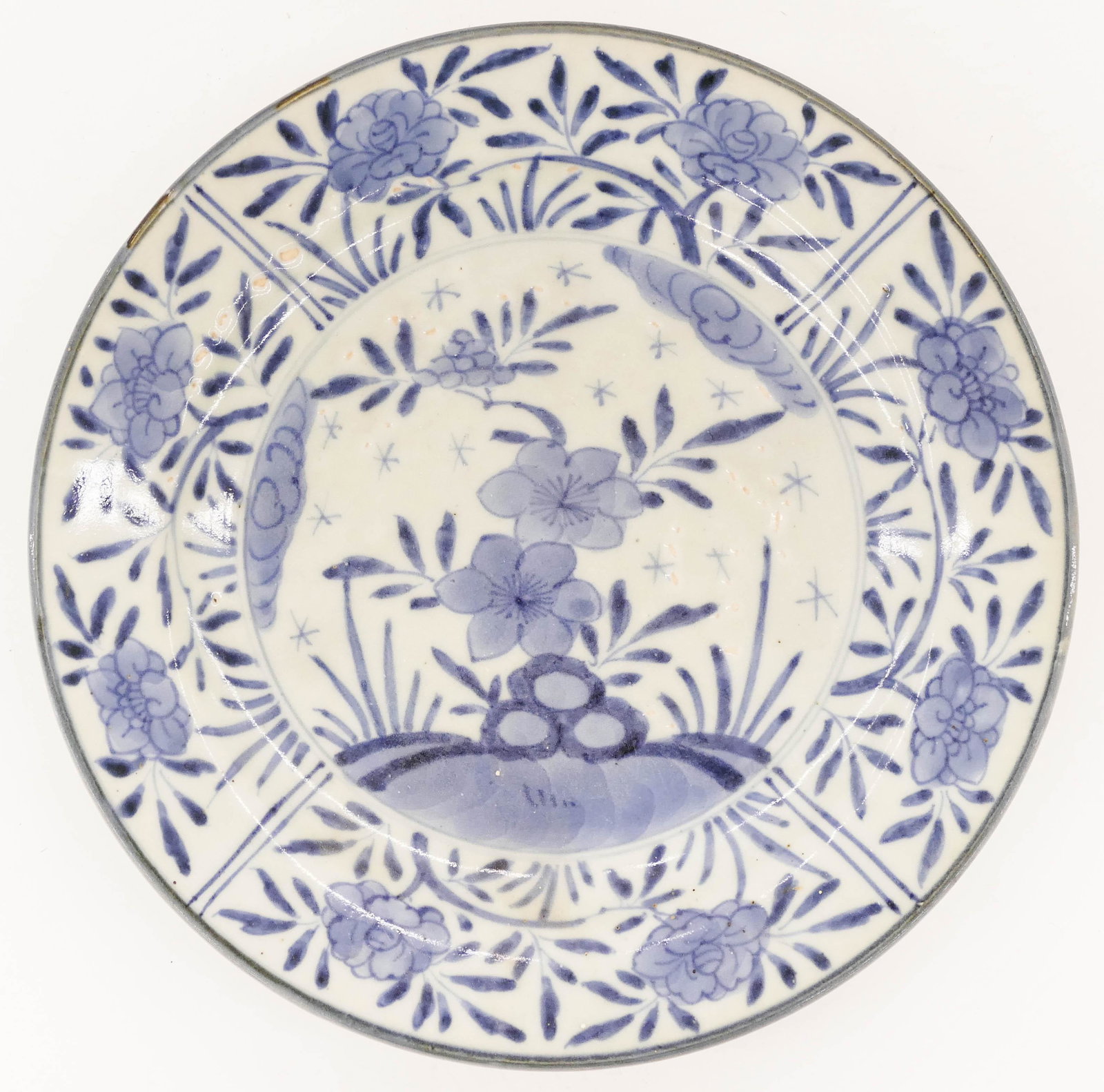 Japanese 17th Cent. Arita Kraak Style Floral Plate: Japanese 17th Cent. Arita Kraak Style Floral Plate 9.5''. A blue and white porcelain plate with blossoming flower motif. Excellent condition. Edo period. Collection of W. Gordon Menzies, Seattle .
