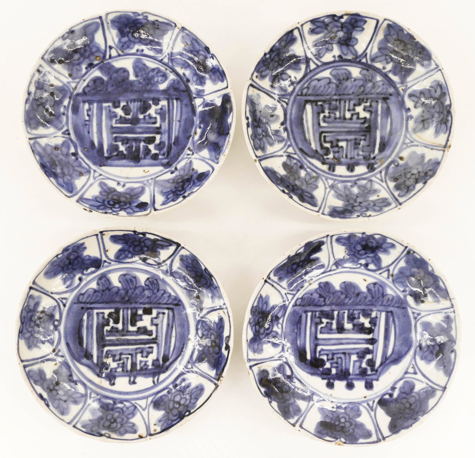 Set of 4 Japanese 17th Cent. Arita Kraak Style Dishes: Set of 4 Japanese 17th Cent. Arita Kraak Style Dishes 5.25''. A set of blue and white porcelain dishes with floral border motifs. Three have small hairline cracks. Edo period. Collection of W. Gordon 