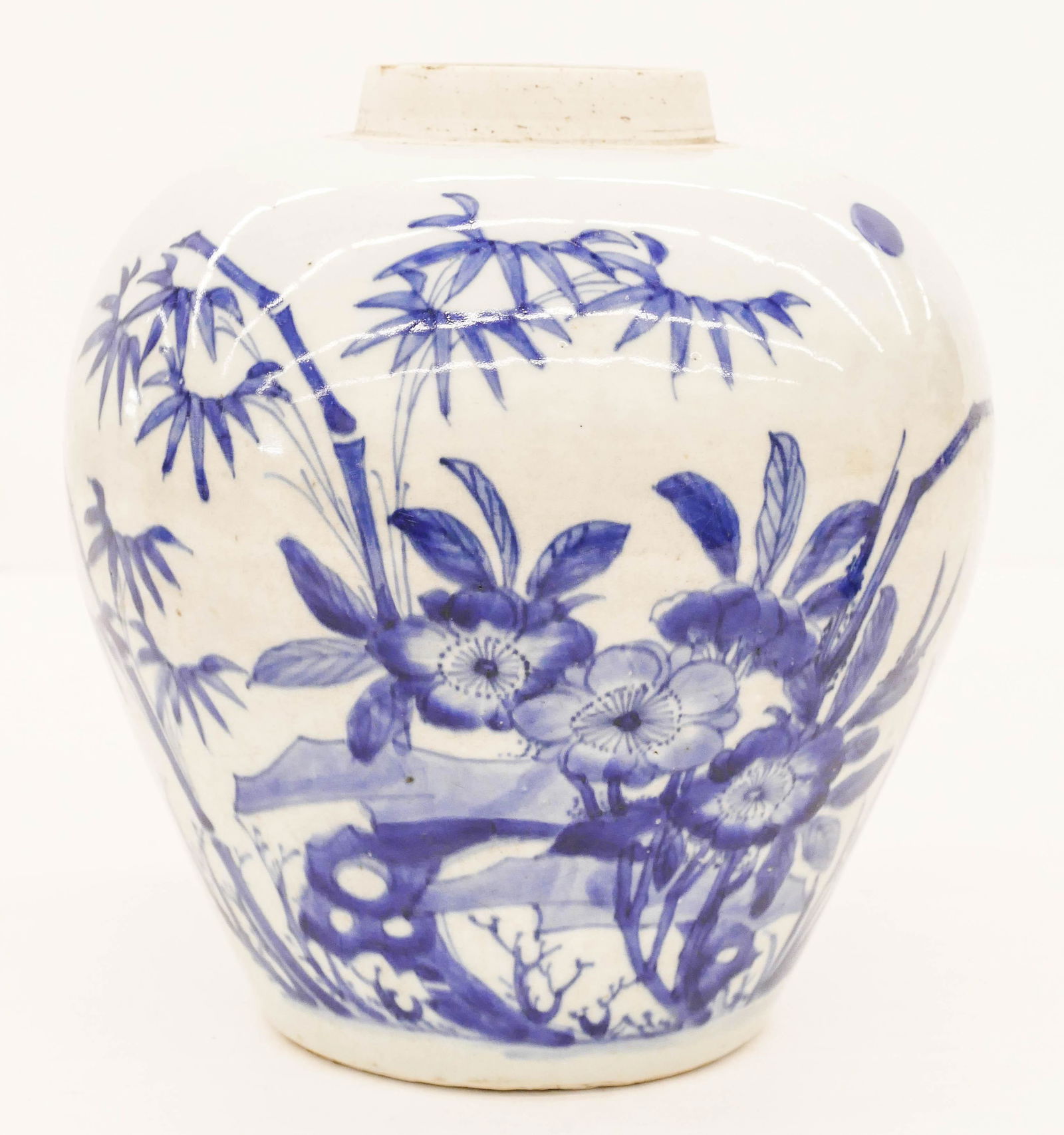 Chinese Transitional Blue and White Jar 9.5''x9'': Chinese Transitional Blue and White Jar 9.5''x9''. A blue and white porcelain jar with bamboo and flower with birds motif. Impact mark on top rim. Overall excellent condition. 17th century. Collection