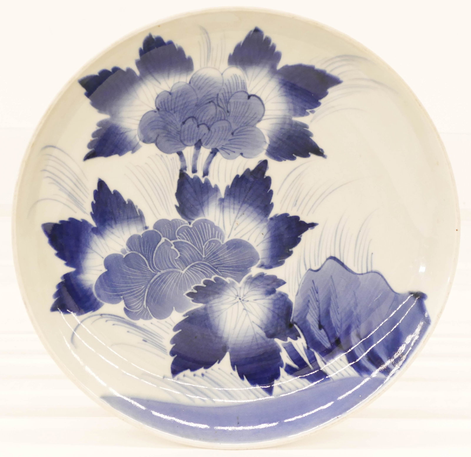 Japanese 19th Cent. Sometsuke Peony Charger 12.5'': Japanese 19th Cent. Sometsuke Peony Charger 12.5''x2''. A blue and white porcelain charger with hand painted flowers. Seven spur marks on bottom. Excellent condition. Edo or early Meiji period. Collec