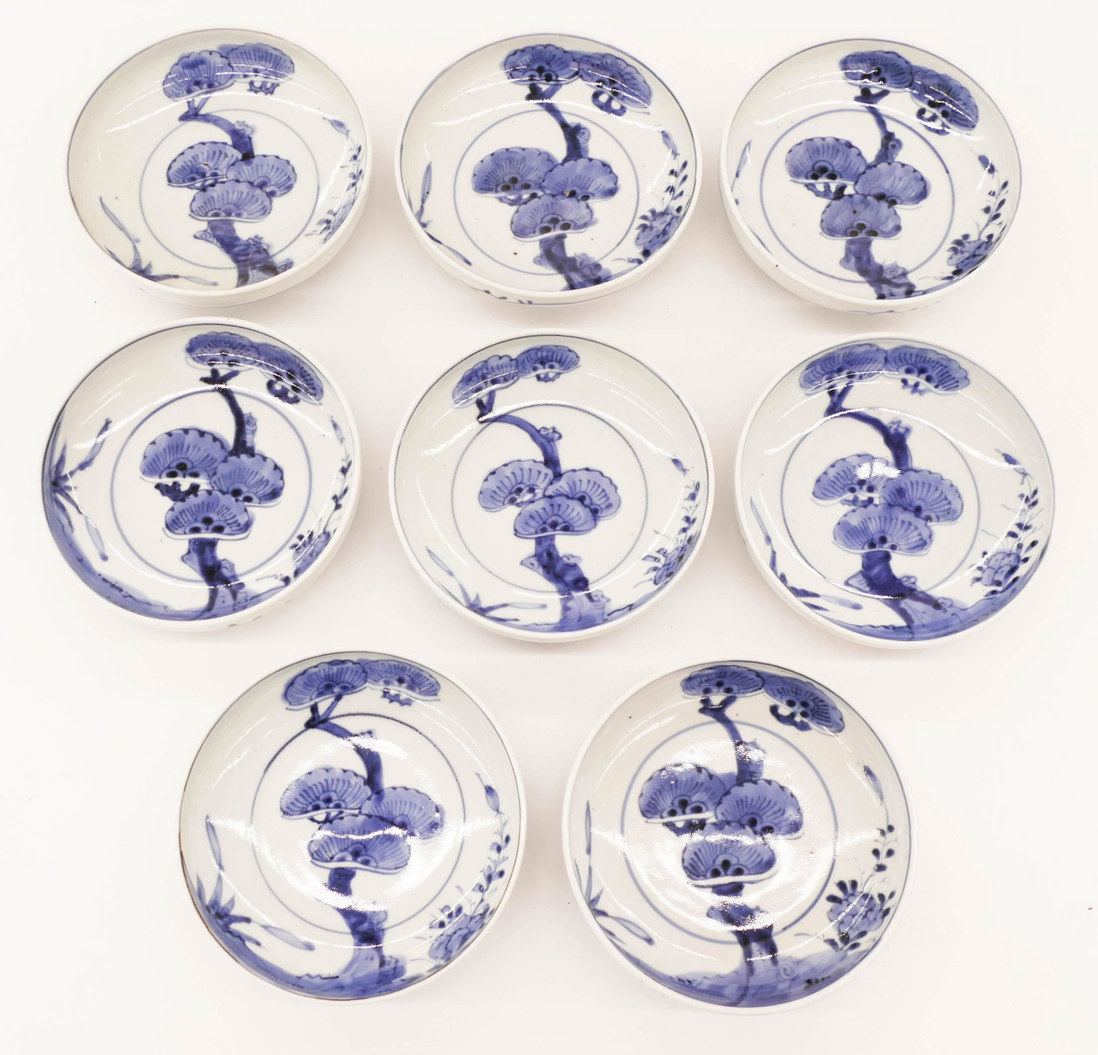 Set 8 Japanese Meiji Sometsuke Pine Tree Low Bowls: Set 8 Japanese Meiji Sometsuke Pine Tree Low Bowls 1.5''x5.75''. A group of matching blue and white porcelain bowls. Excellent condition. 19th century. Collection of W. Gordon Menzies, Seattle.