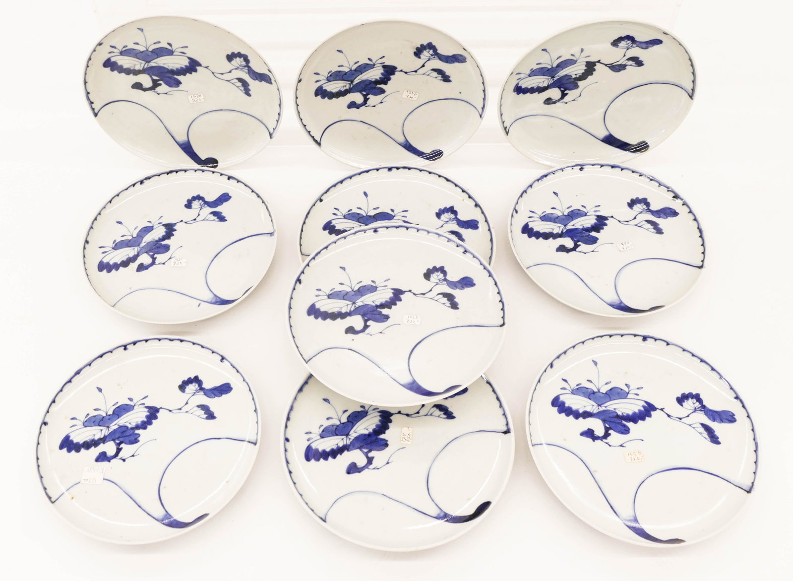 Set 10 Japanese Meiji Sometsuke Plates 7.75'': Set 10 Japanese Meiji Sometsuke Plates 7.75''. Set of ten blue and white porcelain plates with branch motif. Similar to Nabeshima wares. Excellent condition. 19th century. Collection of W. Gordon Menz