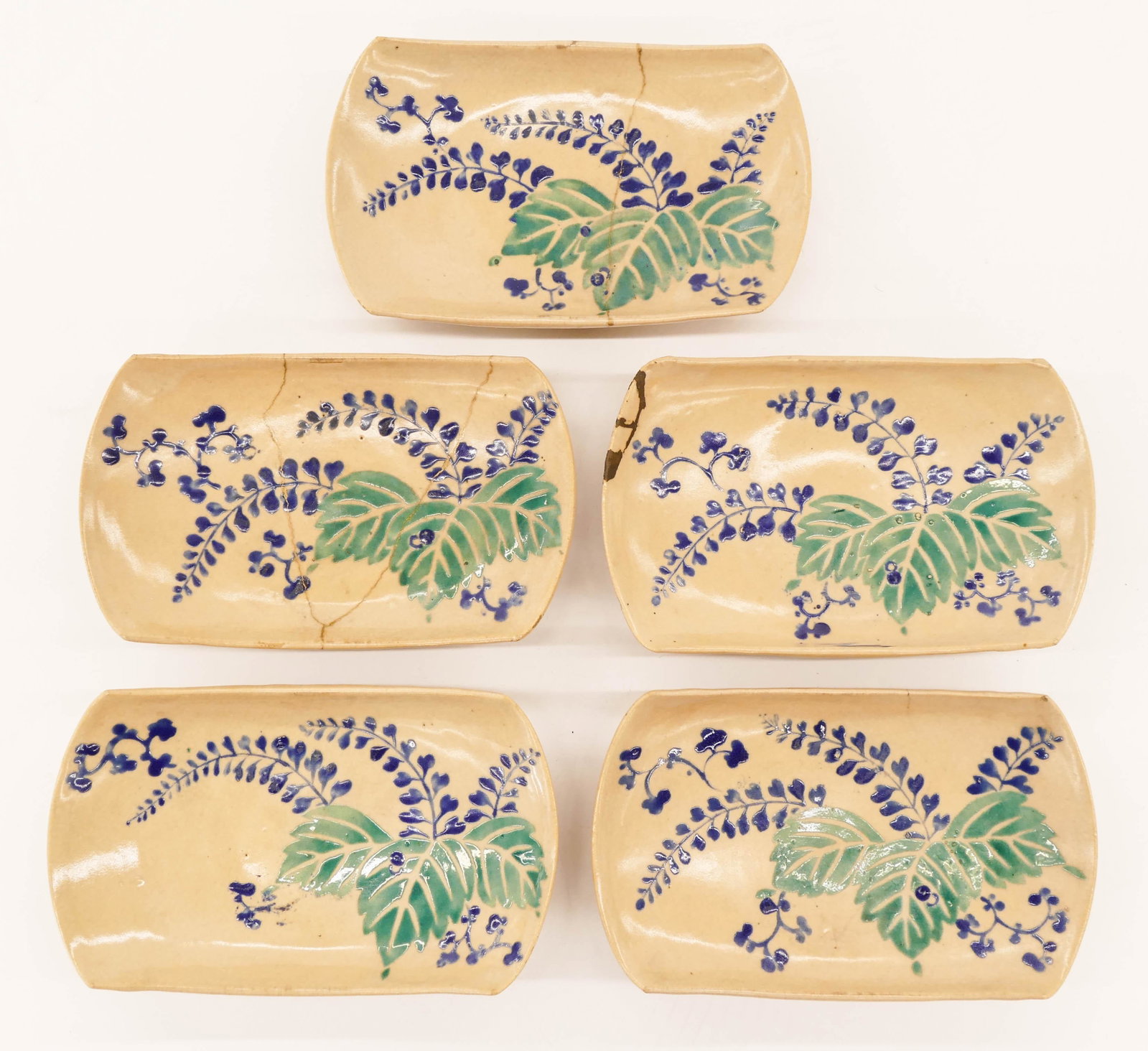 Set 5 Japanese 18th Cent. Kyoyaki Dishes 4''x6.5'': Set 5 Japanese 18th Cent. Kyoyaki Dishes 4''x6.5''. A group of matching kyoto ware rectangular dishes with polychrome enameled leaf motifs. Five have kintsugi repairs or cracks. Edo period. Collection