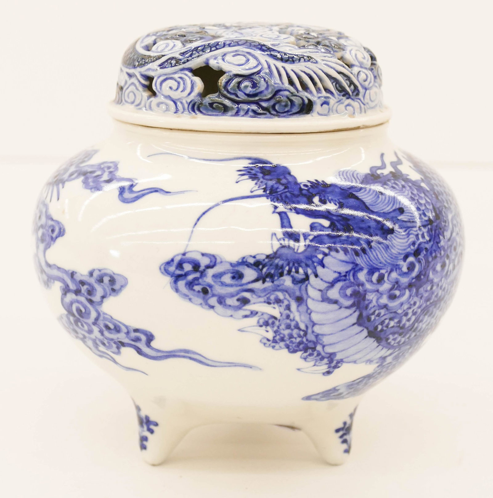 Japanese Meiji Hirado Dragon Koro Censer 5.75'': Japanese Meiji Hirado Dragon Koro Censer 5.75''x5.75''. A fine blue and white porcelain tripod incense burner with fierce three-clawed dragon. Pierced figural dragon cover. Excellent condition. Late 1
