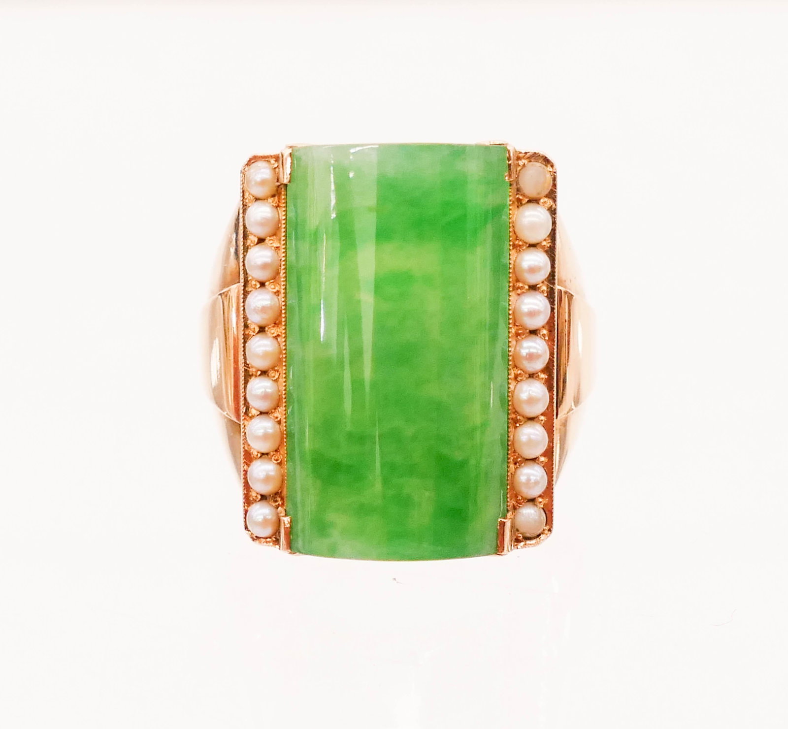 Men's 14k Jadeite and Seed Pearl Ring Size 10.5: Men's 14k Jadeite and Seed Pearl Ring Size 10.5. An art deco ring with rectangular translucent apple green jade panel 24x13x5mm. It is flanked by (18) round seed pearls 2mm (one damaged). Marked ''K14