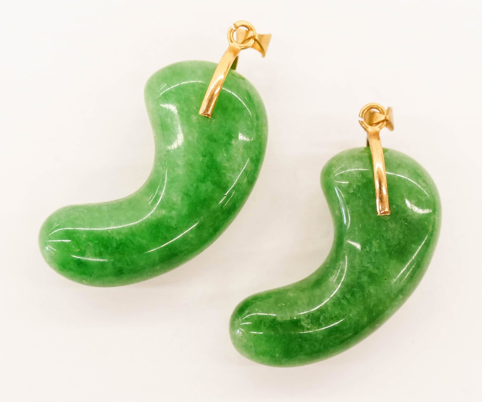 2pc Japanese Jade Magatama Bead Pendants 1.5'': 2pc Japanese Jade Magatama Bead Pendants 1.5''. A pair of carved comma bead jadeite green pendants. Unmarked. 20th century. Collection of W. Gordon Menzies, Seattle.