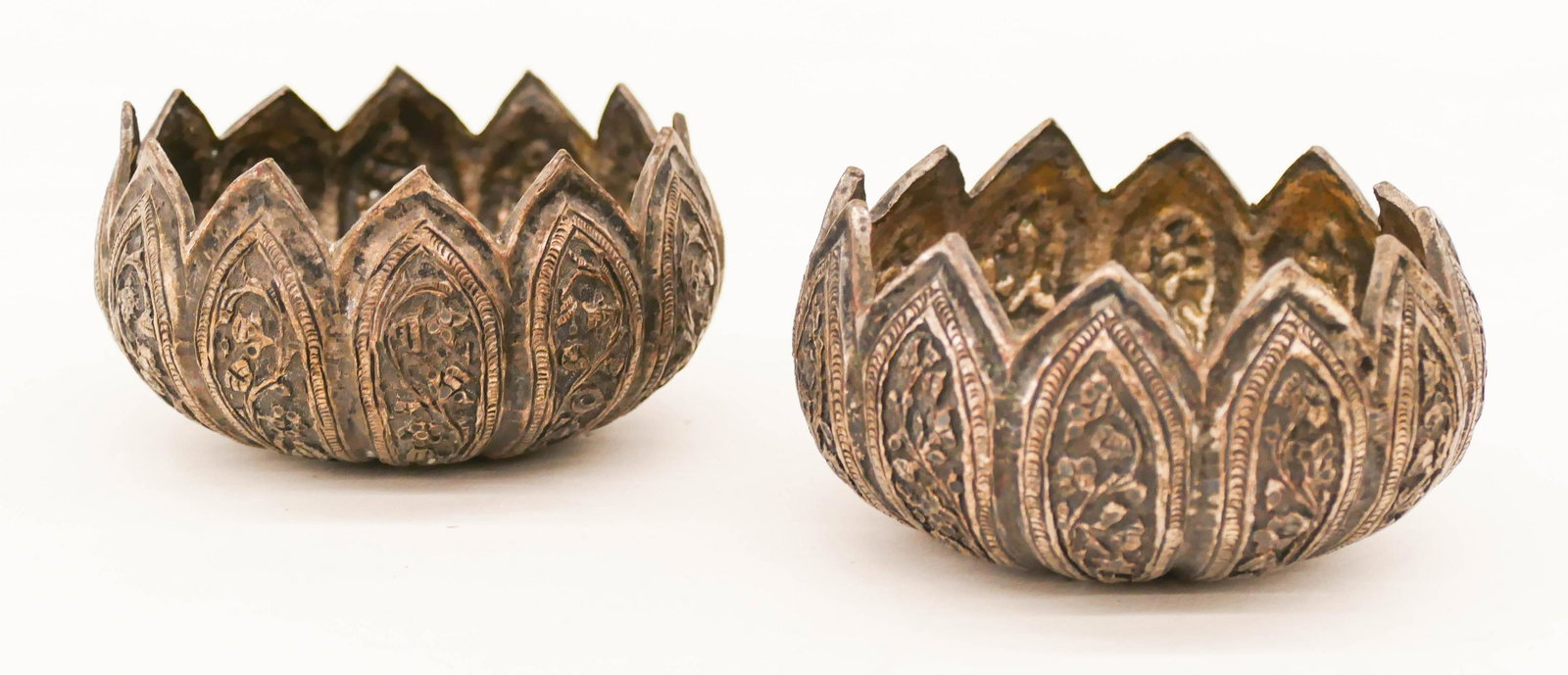 Pair Thai 18th/19th Cent. Silvered Bronze Offering: Pair Thai 18th/19th Cent. Silvered Bronze Offering Bowls 2''x3.5''. An early pair of repousse silvered bronze lotus form bowls. Some bends to edge petals. Thailand, Burmese. Collection of W. Gordon Me