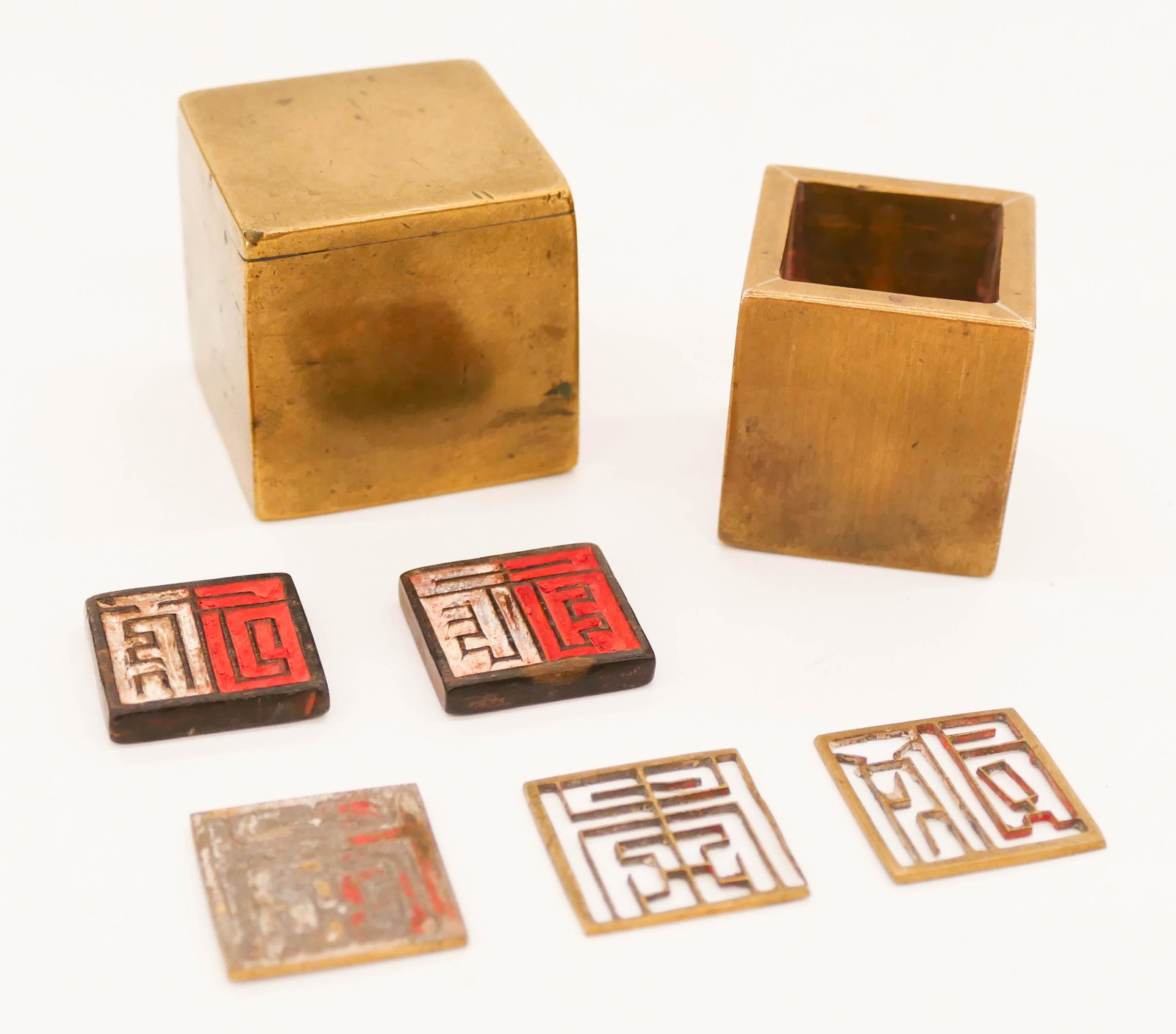 Chinese Qing Bronze Seal Box 1.37''x1.37'': Chinese Qing Bronze Seal Box 1.37''x1.37''. Unusual square bronze box with black seals and seal stencils. Polished body. 19th century. Collection of W. Gordon Menzies, Seattle.