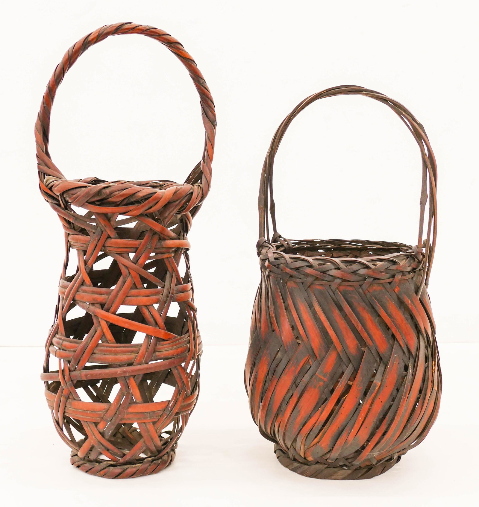 2pc Old Japanese Ikebana Handled Baskets 17'' to 20": 2pc Old Japanese Ikebana Handled Baskets 17'' to 20'' Tall. A duo of hand made flower arranging baskets. The taller one is signed. Excellent condition. Early 20th century, Meiji period.