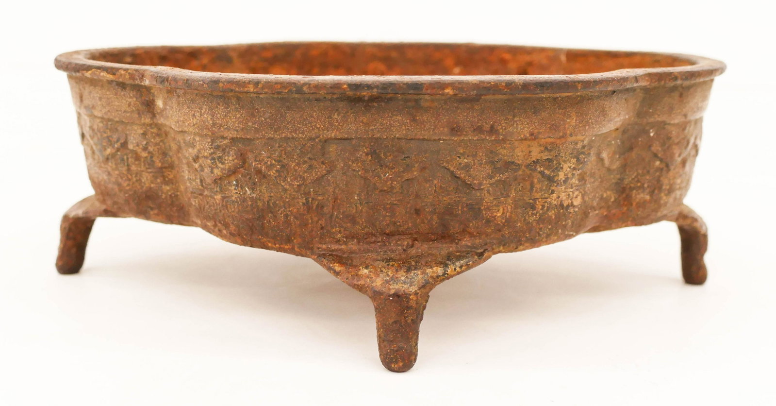 Japanese Edo Iron Bonsai Planter 3''x9'': Japanese Edo Iron Bonsai Planter 3''x9''. An early quatrefoil form footed planter with molded decoration. Scattered surface wear and rust from age. 18th century. Collection of W. Gordon Menzies, Seatt