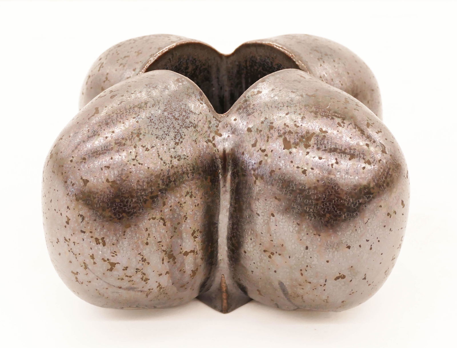 David Shaner ''X'' Pillow Pot Glazed Stoneware: David Shaner (1934-2002 Montana) ''X'' Pillow Pot Glazed Stoneware 6''x8.5''. Gun metal glazed vessel with an ''x'' form. Signed on bottom. Excellent condition. Collection of Patrick and Darle Maveety