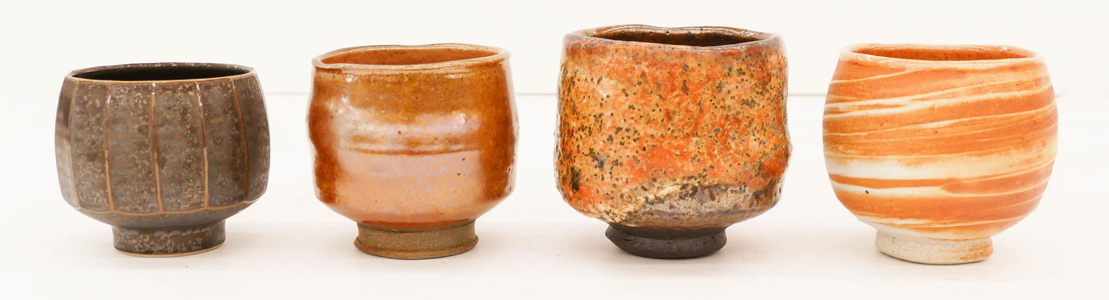 4pc David Shaner and Tom Coleman Chawan Tea Bowls: 4pc David Shaner and Tom Coleman Chawan Tea Bowls 4'' Approx. Wheel thrown with shino and gun metal glazes. Includes three by Coleman and one Shaner. Signed on bottom. Excellent condition. Collection