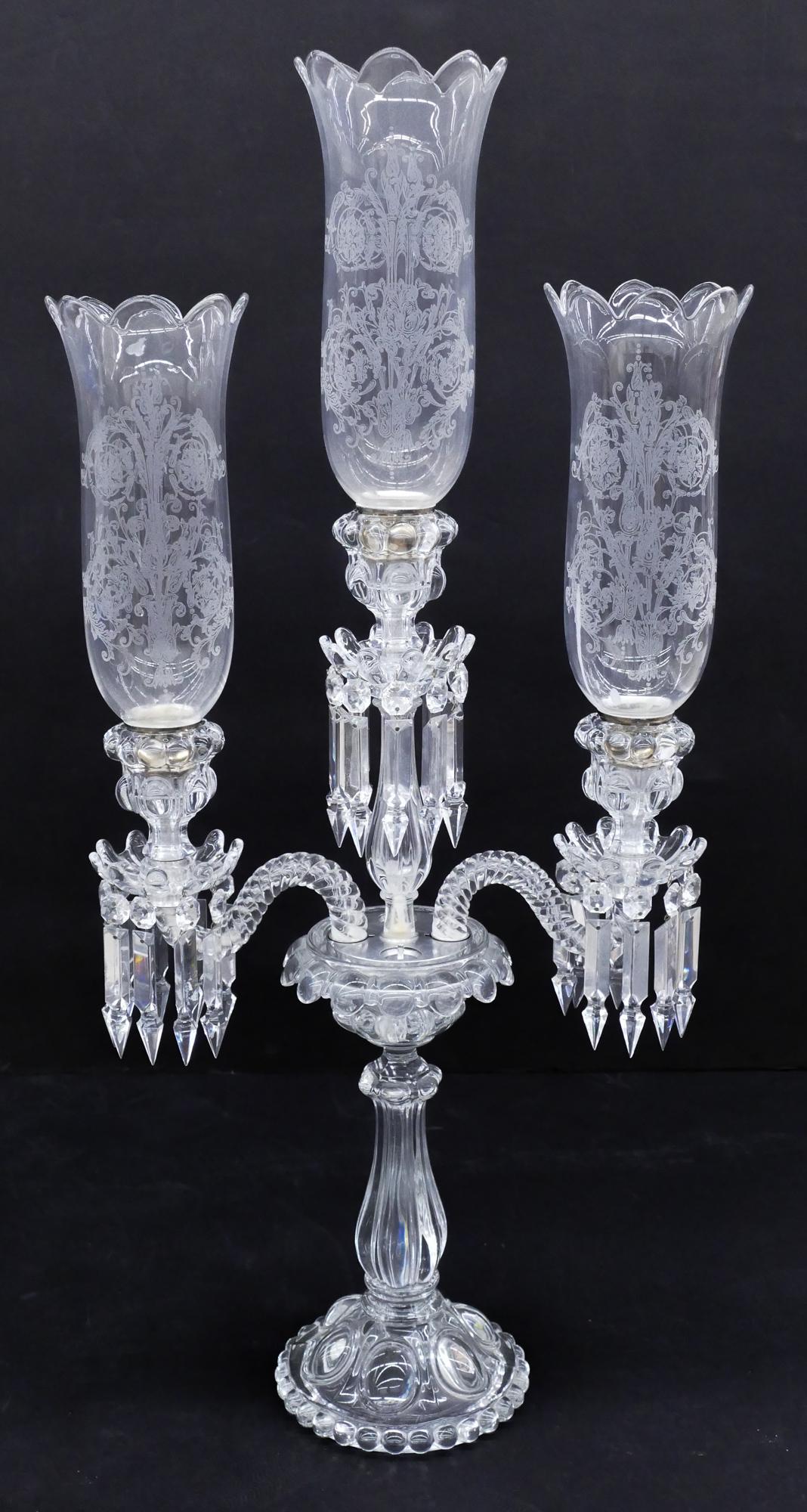 Antique Baccarat Glass Candelabra: Antique Baccarat Glass Candelabra 33''x16''. A four-arm glass candelabra with bobeches and original instructions. Two arms have broken. Includes five original acid etched hurricane shades.
