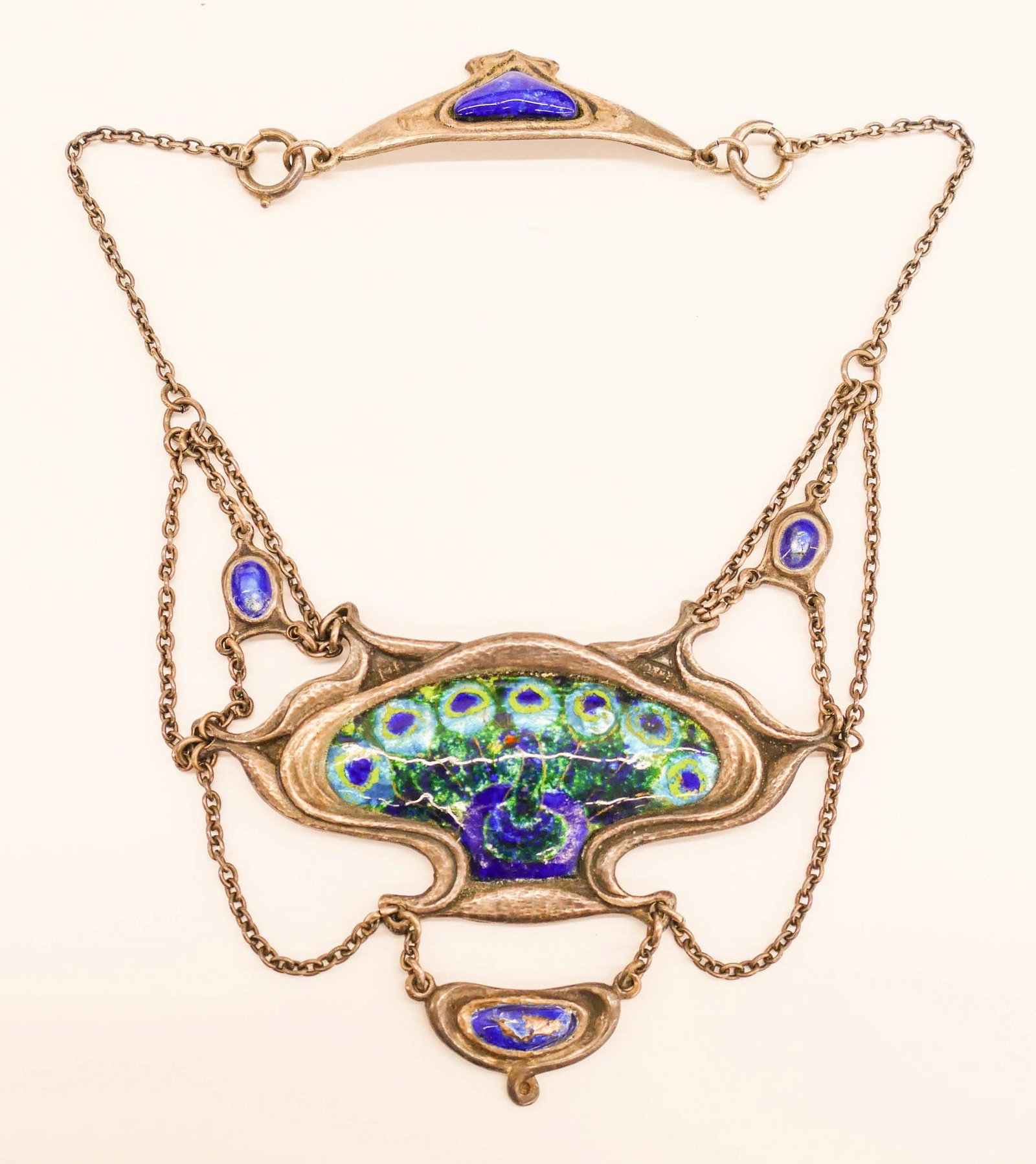 Omar Ramsden Art Nouveau Silver Peacock Necklace: Omar Ramsden Art Nouveau Silver Peacock Necklace 15''. A scarce polychrome enameled sterling silver festoon necklace with central peacock motif 3''x3.5''. London hallmarks for Omar Ramsden & Alwyn Car