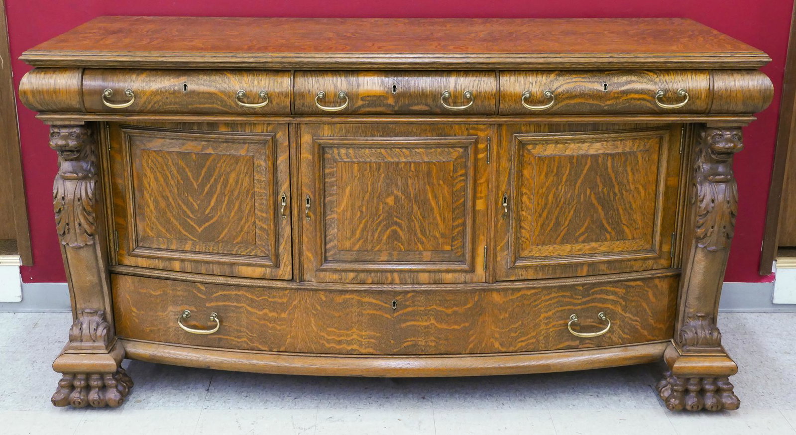 Antique R.J. Horner Attr. Oak Lion's Head Buffet: Antique R.J. Horner Attr. Oak Lion's Head Buffet 37.5''x69''x27''. A heavily carved American oak seven-drawer sideboard with lion's head ornament and claw feet. Unmarked.