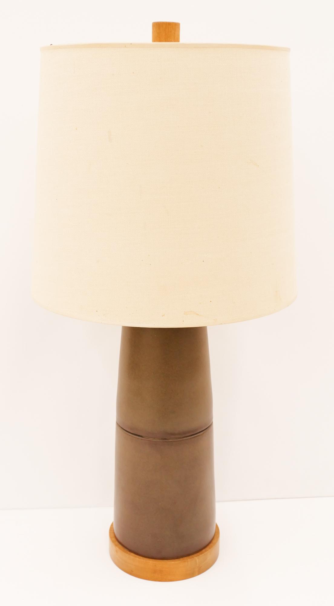 Marshall Martz Ceramic Table Lamp: Marshall Martz Ceramic Table Lamp 33.5''x16''. Mid century brownish-green pottery table lamp by Gordon and Jane Martz. Original teak finial and shade. Unmarked. Shade has some staining.