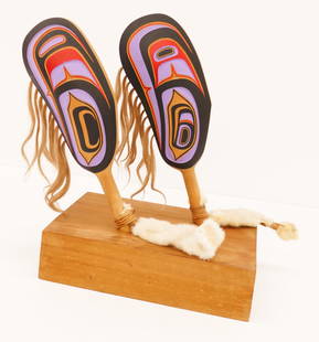 Beau Dick ''Pair of Mussel Rattles'' on Stand: Beau Dick (1955-2017 Kwakiutl) ''Pair of Mussel Rattles'' on Stand Painted Cedar 18''x17''x9''. Impressive pair of Northwest Coast carved and painted cedar shell rattles with u-form motifs. Solid ceda